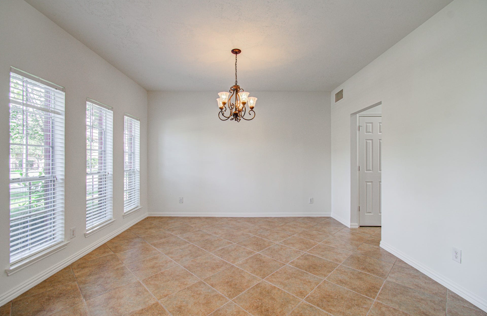 1402 Pine Knot Court, Pearland, TX 77581 Host family dinners in this formal dining area.