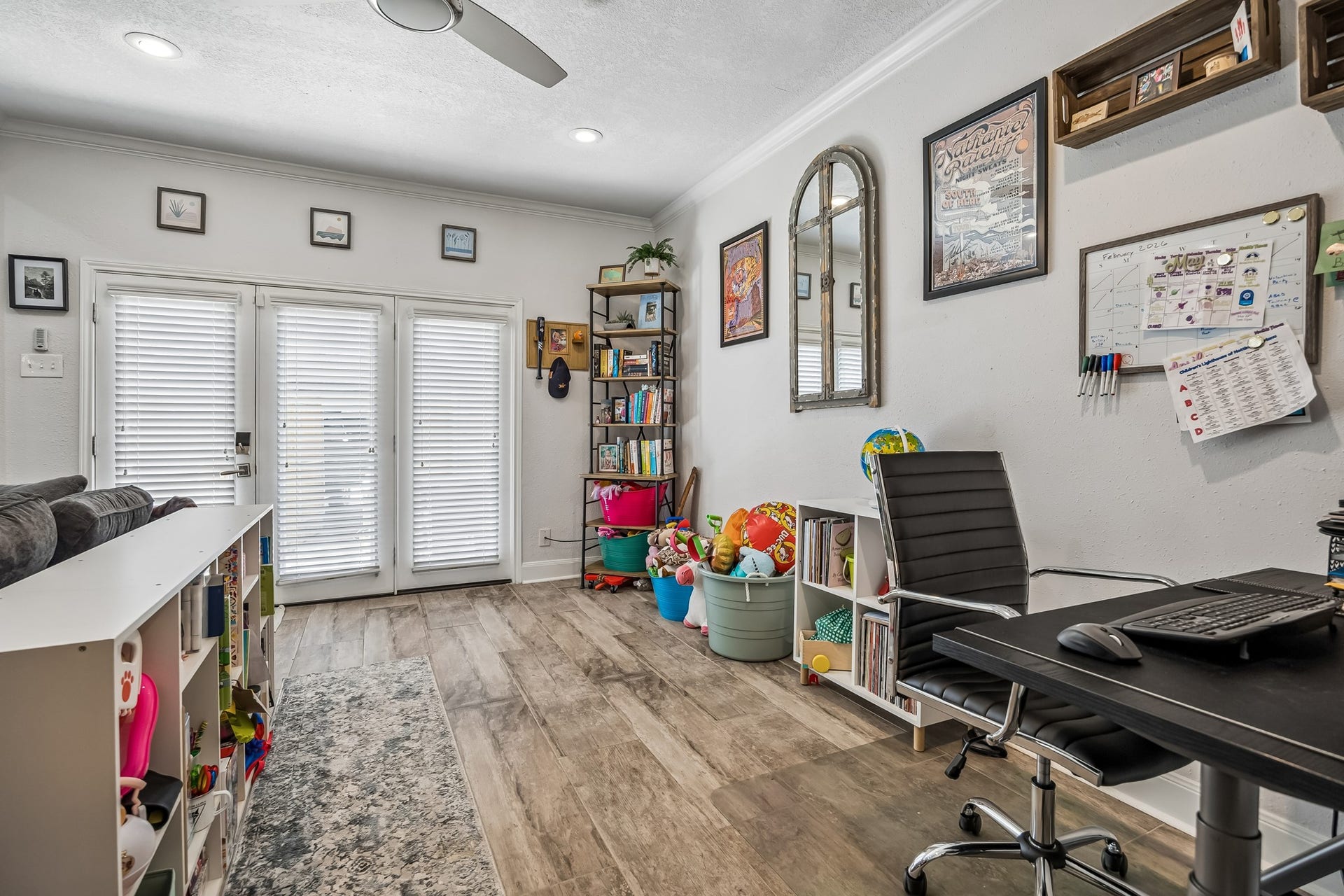 14719 Barryknoll Lane, #51, Houston, TX 77079 A dedicated workspace sits just off the family room, offering a convenient spot for remote work, homework, or household planning. Glass doors nearby bring in natural light and provide easy access to the patio.