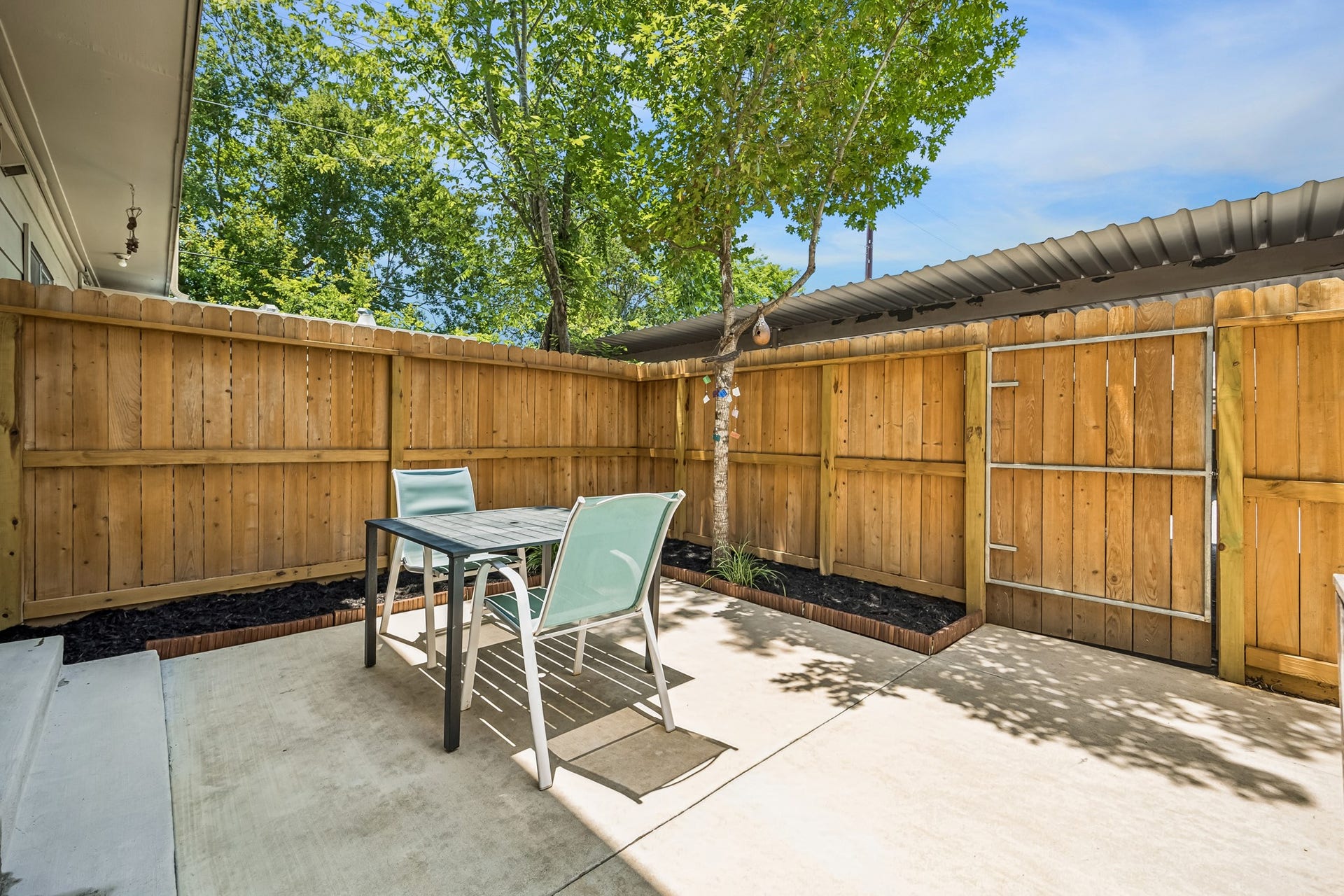 14719 Barryknoll Lane, #51, Houston, TX 77079 The private fenced patio offers low-maintenance outdoor living with space for a dining set, grill, or container plants. Mature trees provide shade, while the surrounding fence creates a comfortable setting for relaxing or entertaining.