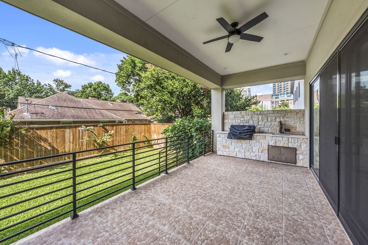 2046 MacArthur Street, Houston, TX 77030 Covered Back Patio offers outdoor kitchen with grill and sink.