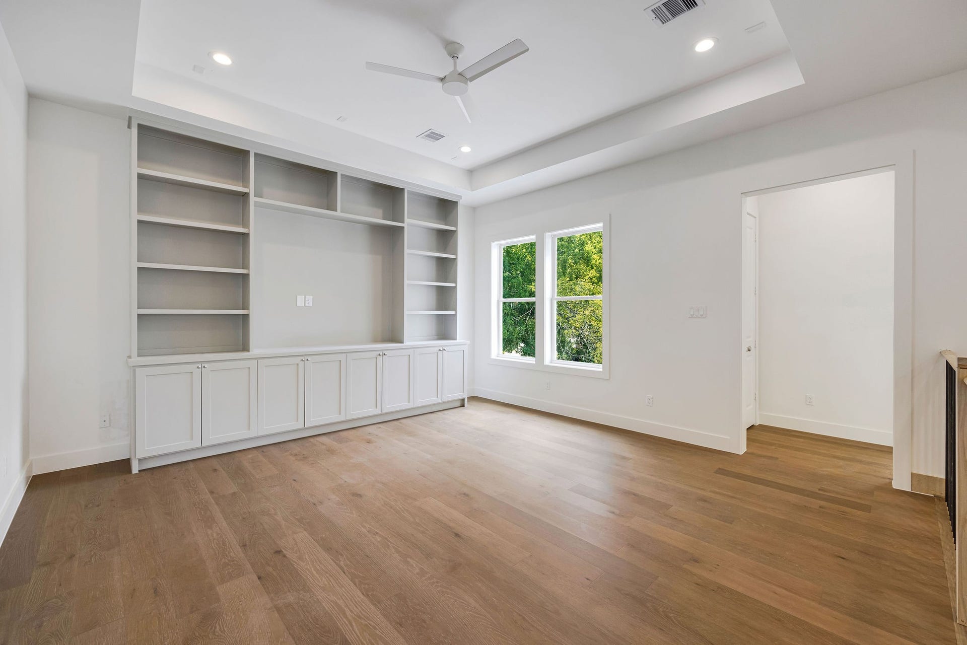 1726 Saxon Drive, Houston, TX 77018 Upstairs, the sizable game room with custom built-ins provides an ideal space for relaxation or play.