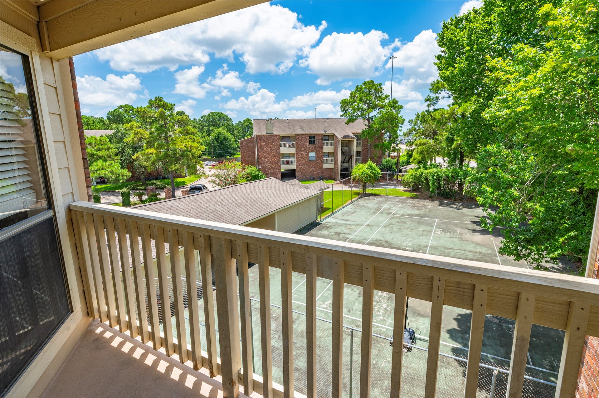 2501 Gulf Freeway, #6A, Dickinson, TX 77539 Living Room balcony looking over tennis court and main entrance