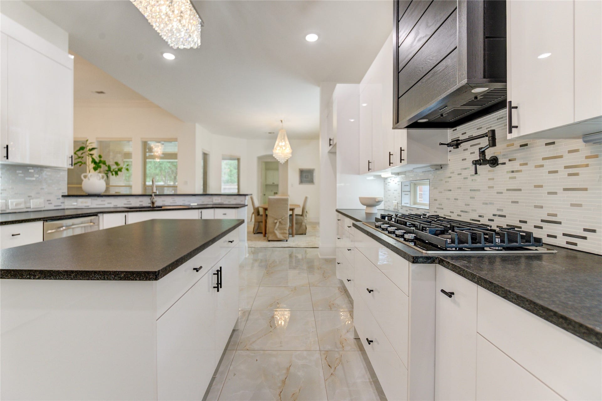 27715 Guthrie Ridge Ln, Katy, TX 77494 A spacious island ideal for entertaining, enhanced by a convenient pot filler.