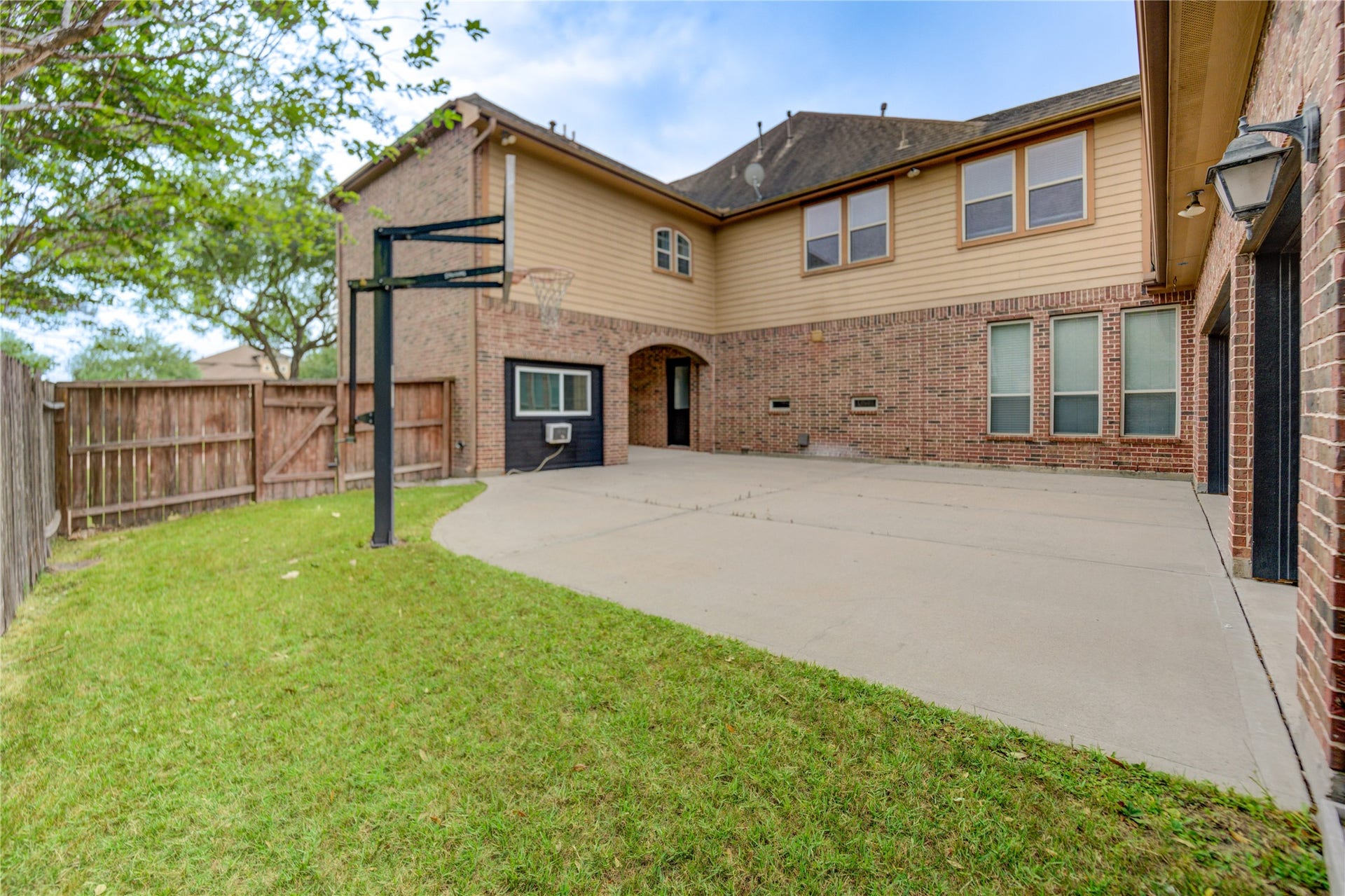 27715 Guthrie Ridge Ln, Katy, TX 77494 The gated driveway offers enhanced privacy and security.