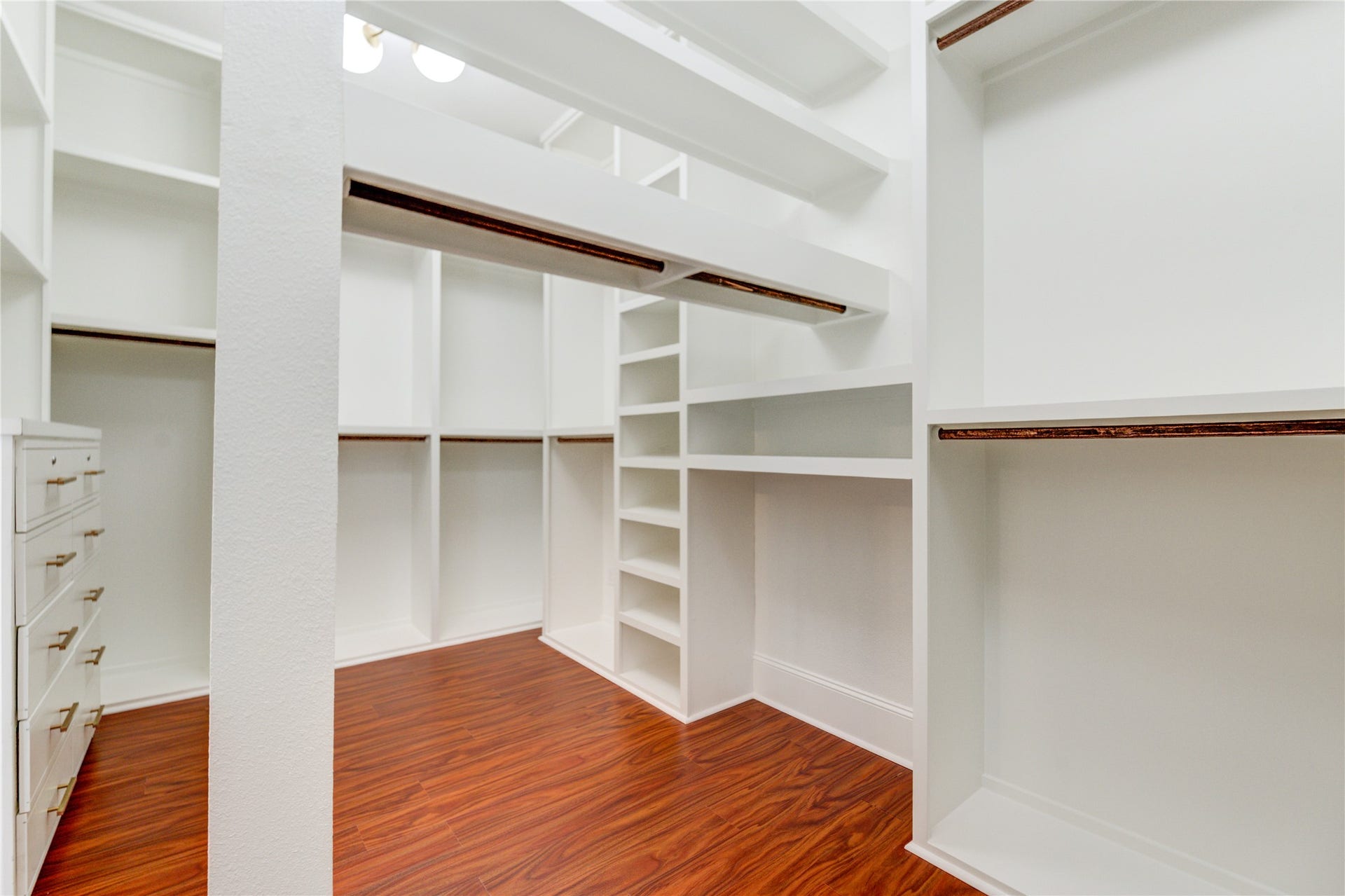 27715 Guthrie Ridge Ln, Katy, TX 77494 The primary suite boasts a thoughtfully designed walk-in closet with custom built-ins and plenty of hanging space, combining luxury and functionality.