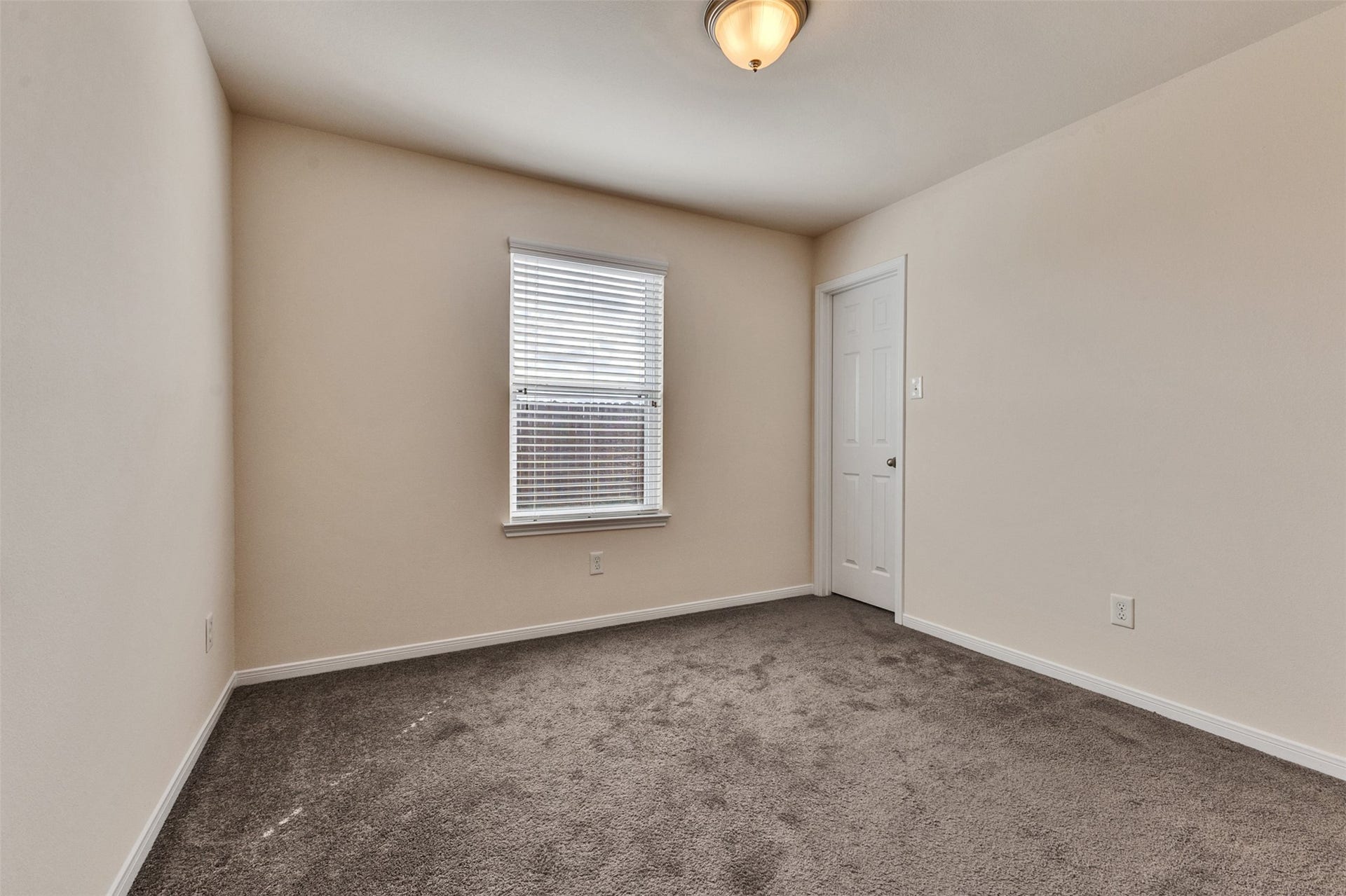 12915 Almeda Crossing Court, Houston, TX 77048 Bright secondary bedroom with fresh interior paint and natural light.