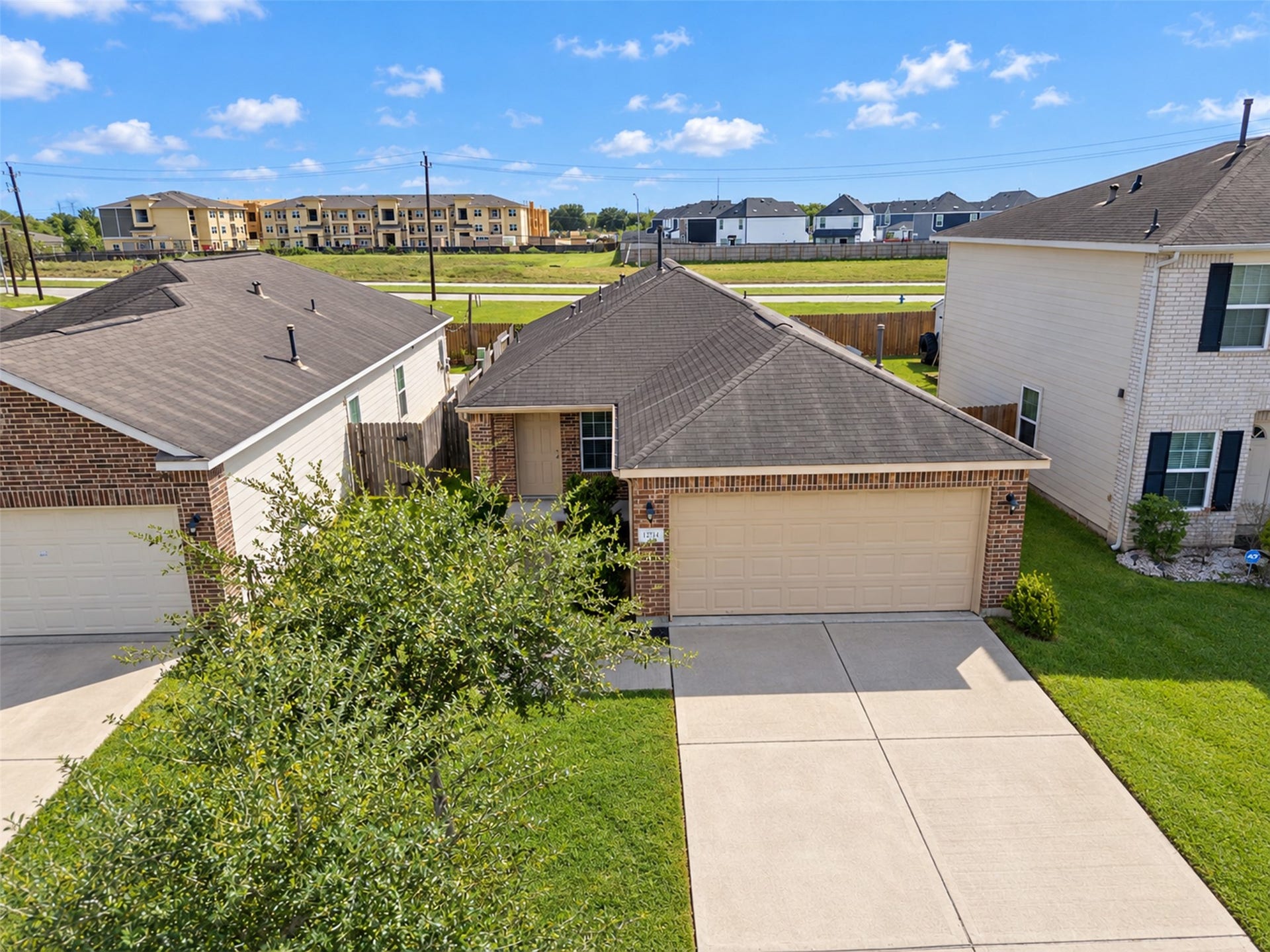 12915 Almeda Crossing Court, Houston, TX 77048 Aerial view showcasing this charming one-story home with an attached two-car garage and well-maintained exterior