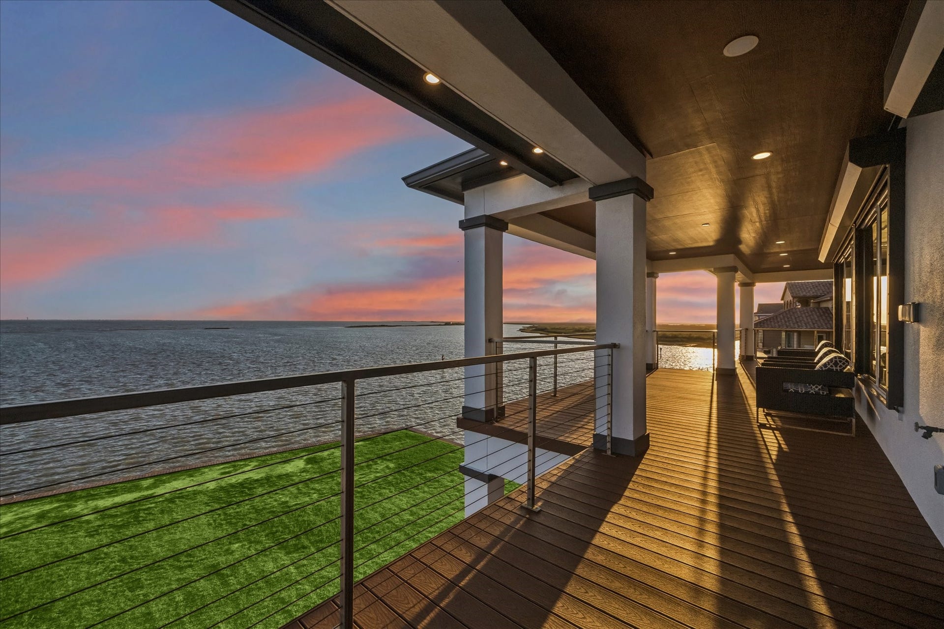 1 Water Key, Hitchcock, TX 77563 Capture unforgettable views from the second-level balcony, where the sunset paints the sky and reflects across the bay