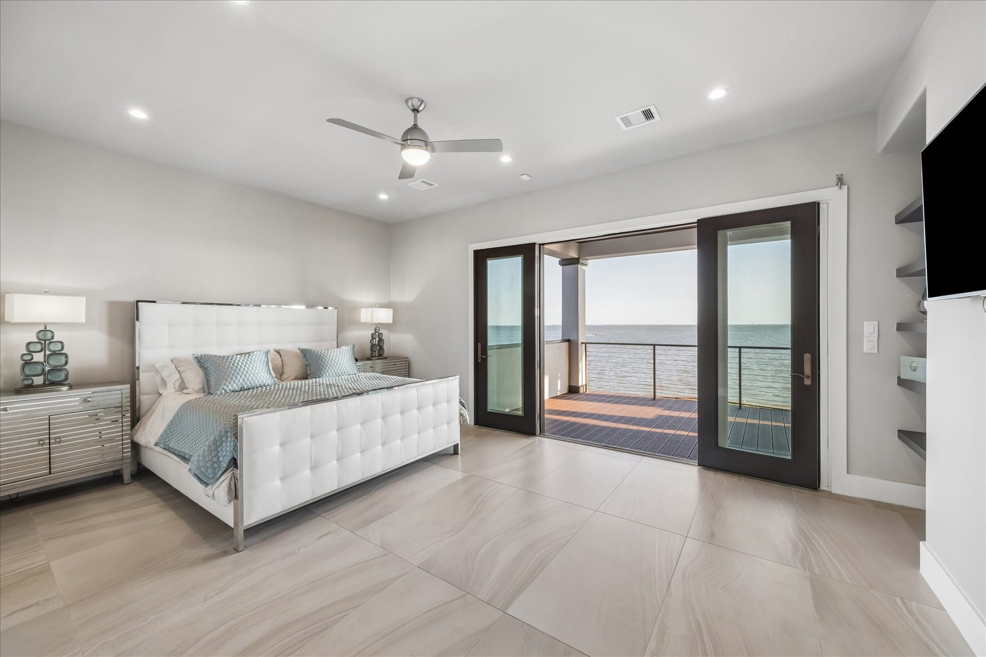 1 Water Key, Hitchcock, TX 77563 Primary bedroom showing the French doors open to the balcony