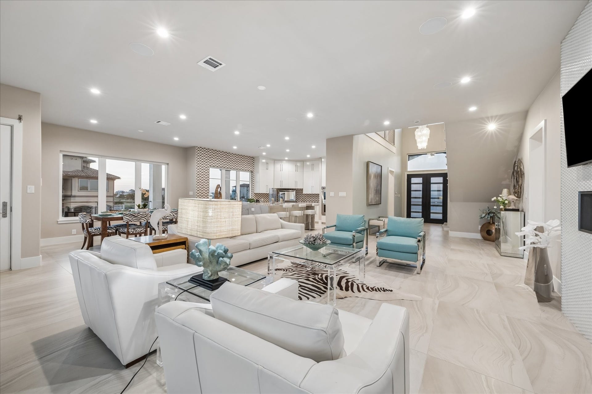 1 Water Key, Hitchcock, TX 77563 Open-concept layout seamlessly connects the kitchen, dining, and living areas for effortless flow and entertaining