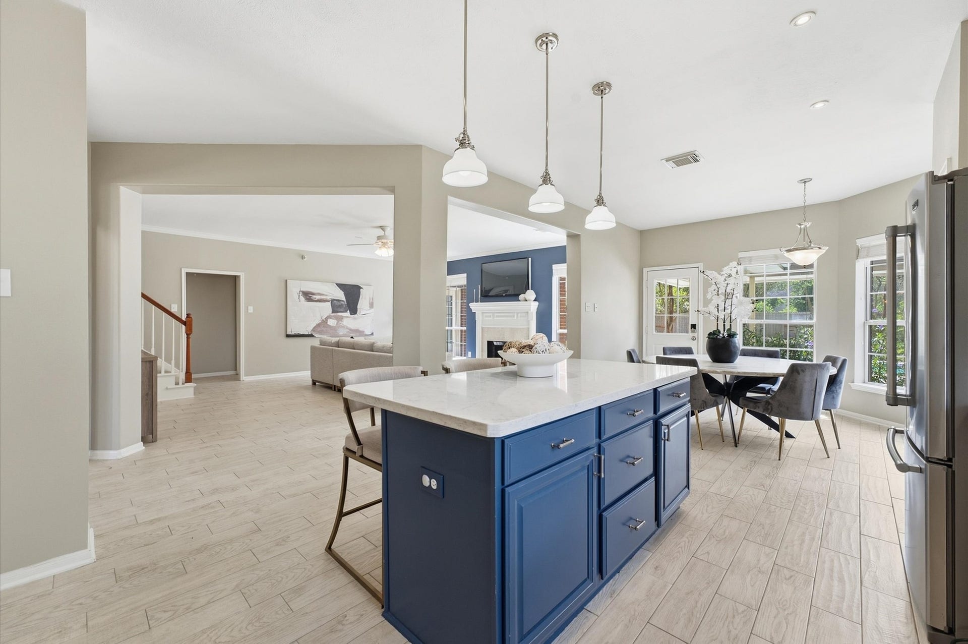 3010 Peekskill Court, Pearland, TX 77584 Navy kitchen island features quartz countertops and seating for casual dining.