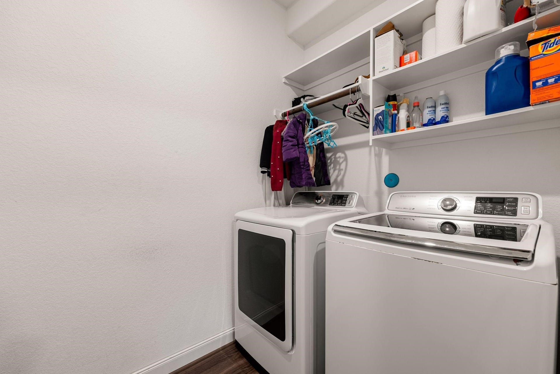 20422 Alpine Meadow Place, Richmond, TX 77407 A dedicated laundry space with built-in overhead shelving to keep essentials tidy.
