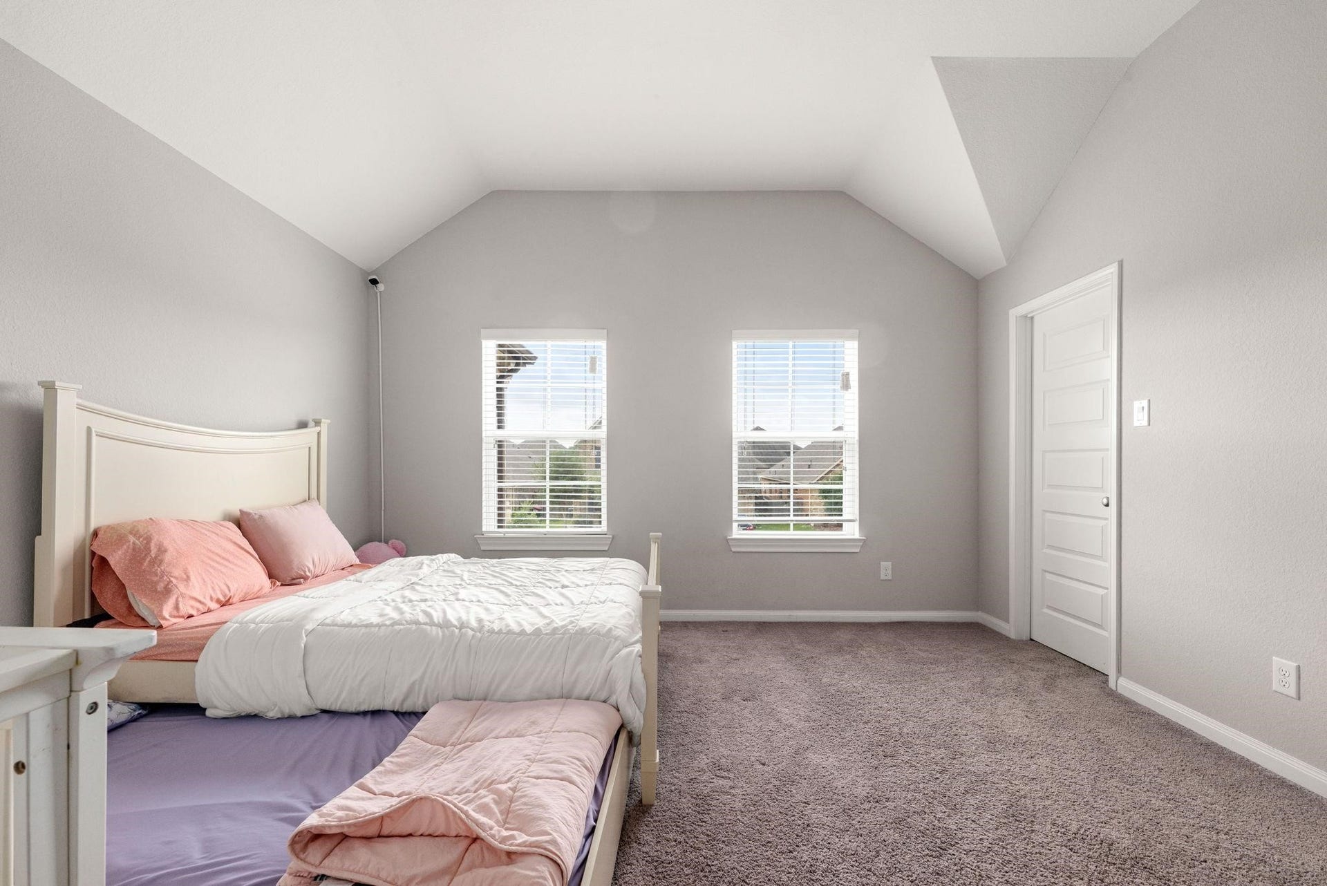 20422 Alpine Meadow Place, Richmond, TX 77407 Bright and soothing, this upper-level bedroom offers plush carpeting and plenty of natural light.