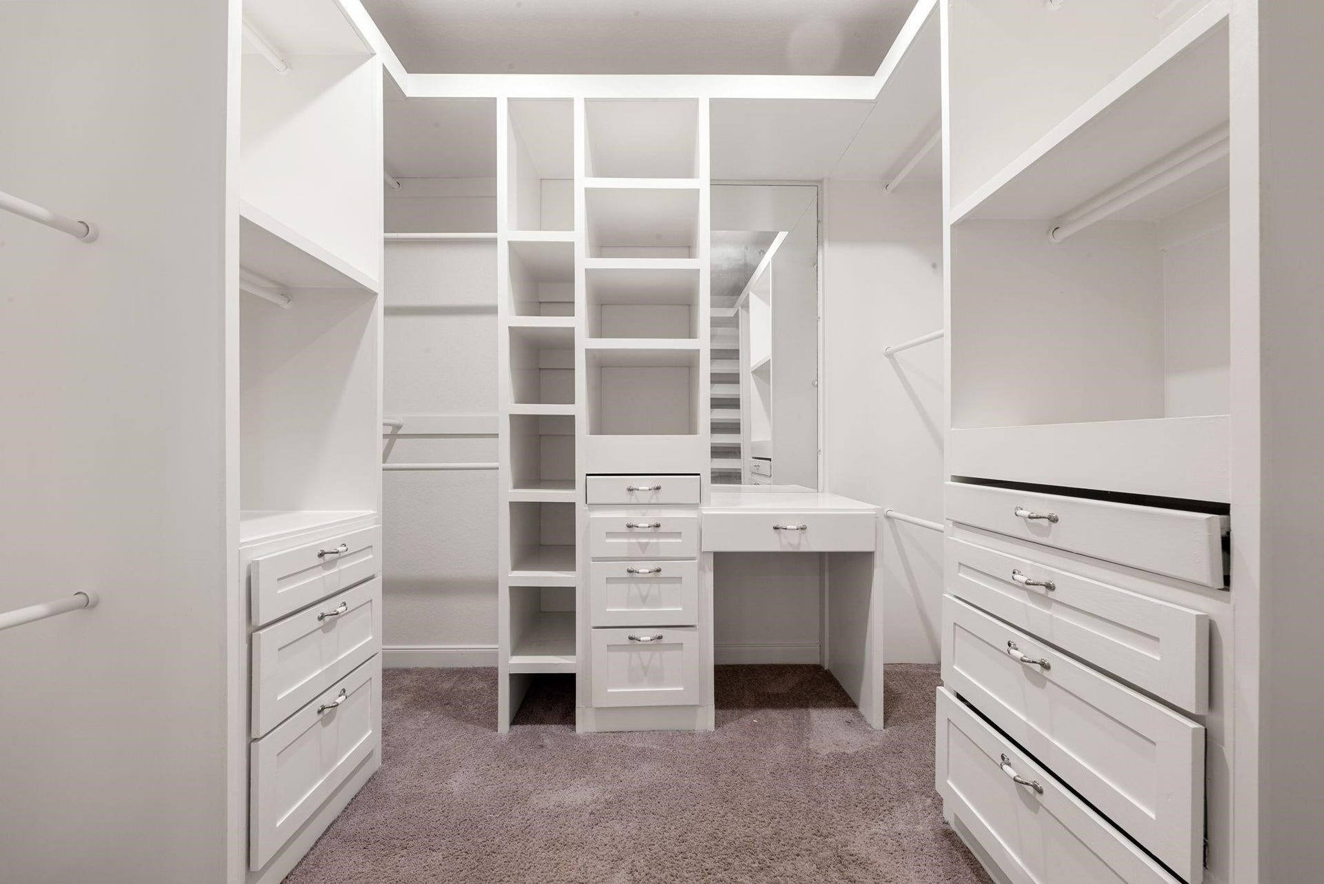 20422 Alpine Meadow Place, Richmond, TX 77407 Custom built-in shelving, drawers, and hanging racks keep everything organized and easy to reach in the large full-entry closet.