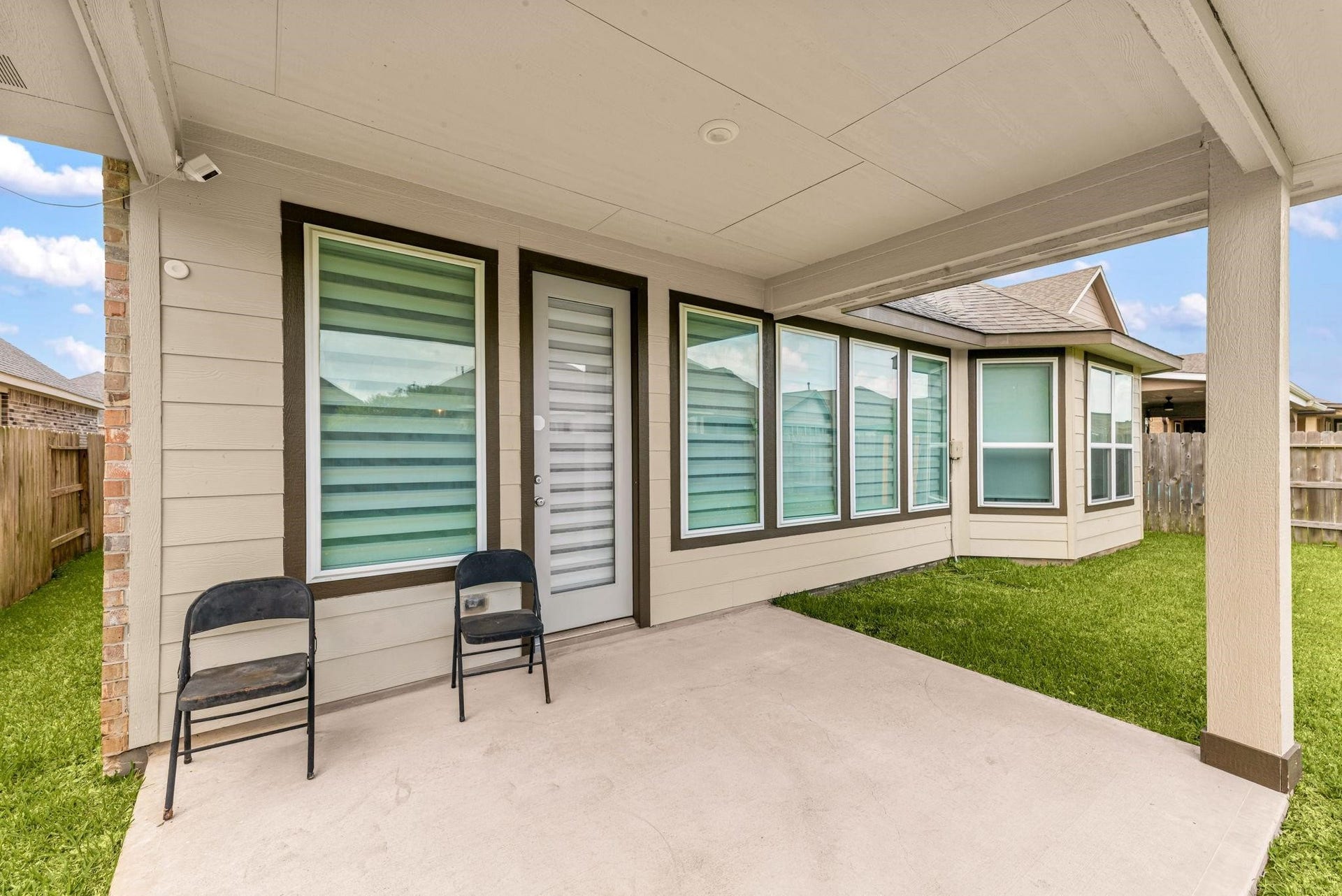 20422 Alpine Meadow Place, Richmond, TX 77407 The covered back patio is a great spot to sit outside in the shade and overlook the yard.