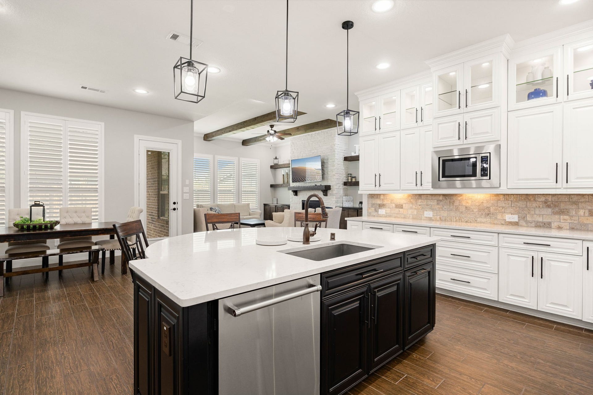 The island's prep sink makes food prep effortless, with the adjoining breakfast nook just steps away for easy everyday living.