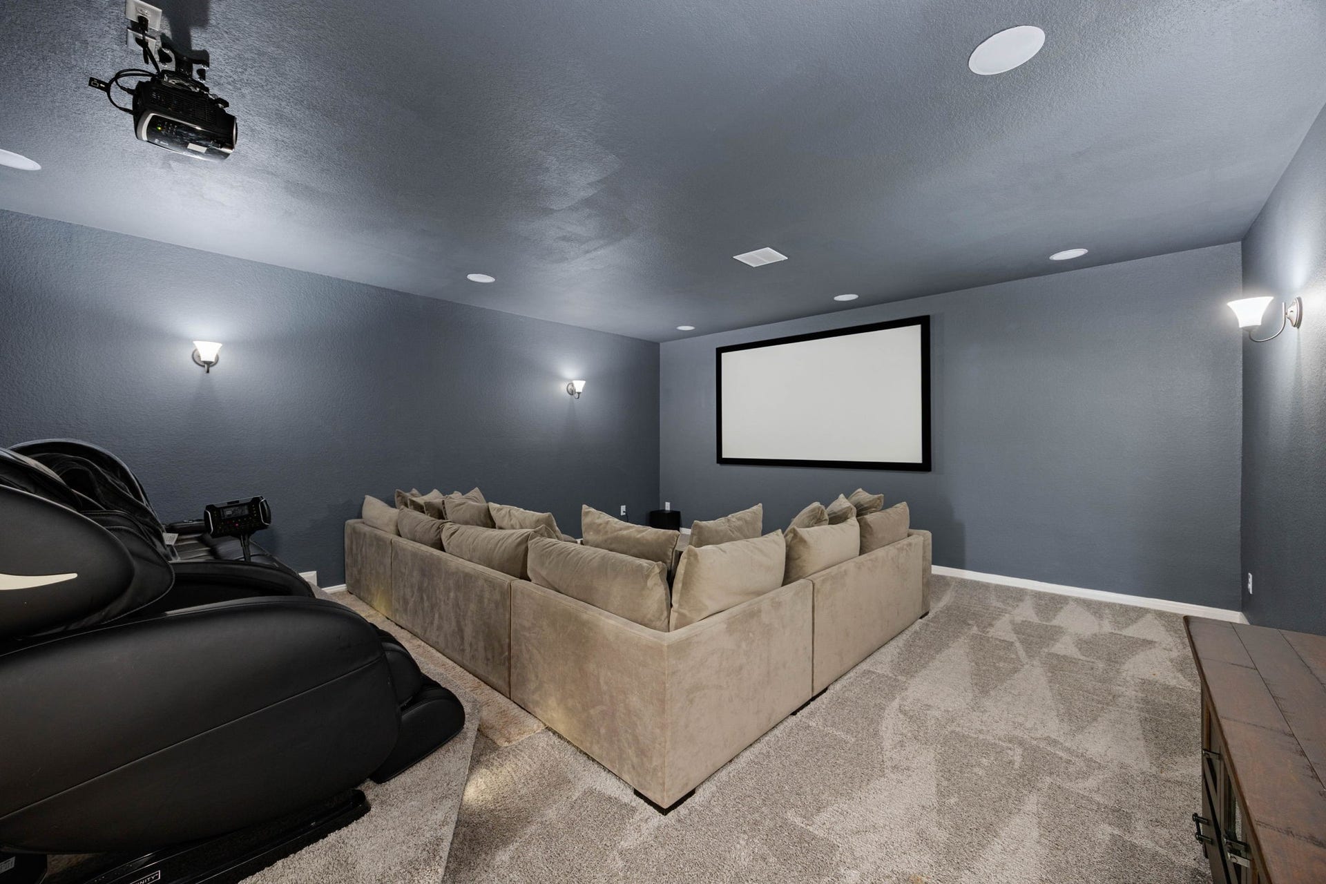 Movie night has its own address. The dedicated media room is already set with a projector screen and oversized built-in sectional.