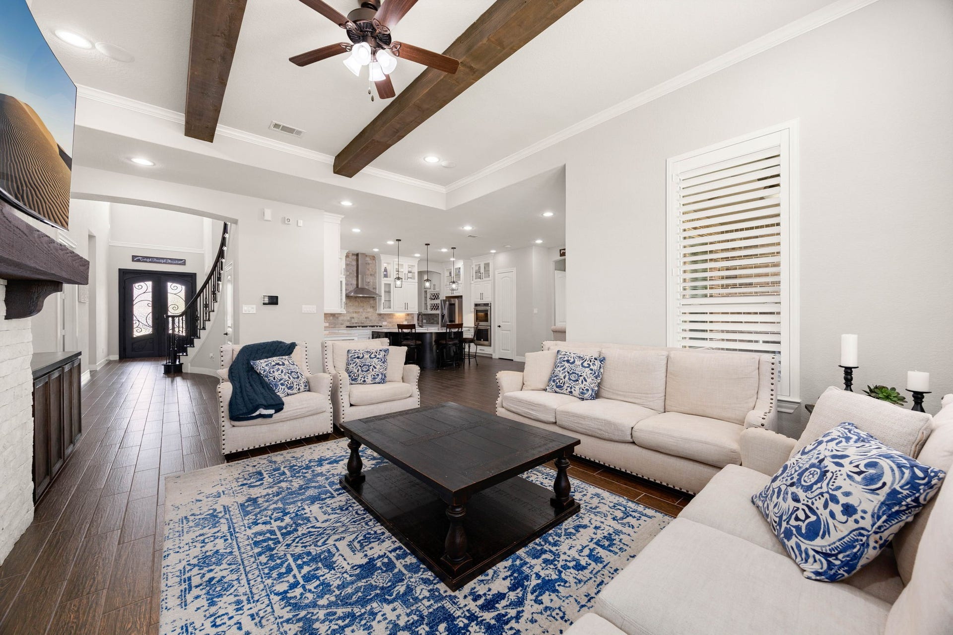 Open to the kitchen beyond, the living room offers effortless flow for everyday living and entertaining alike.