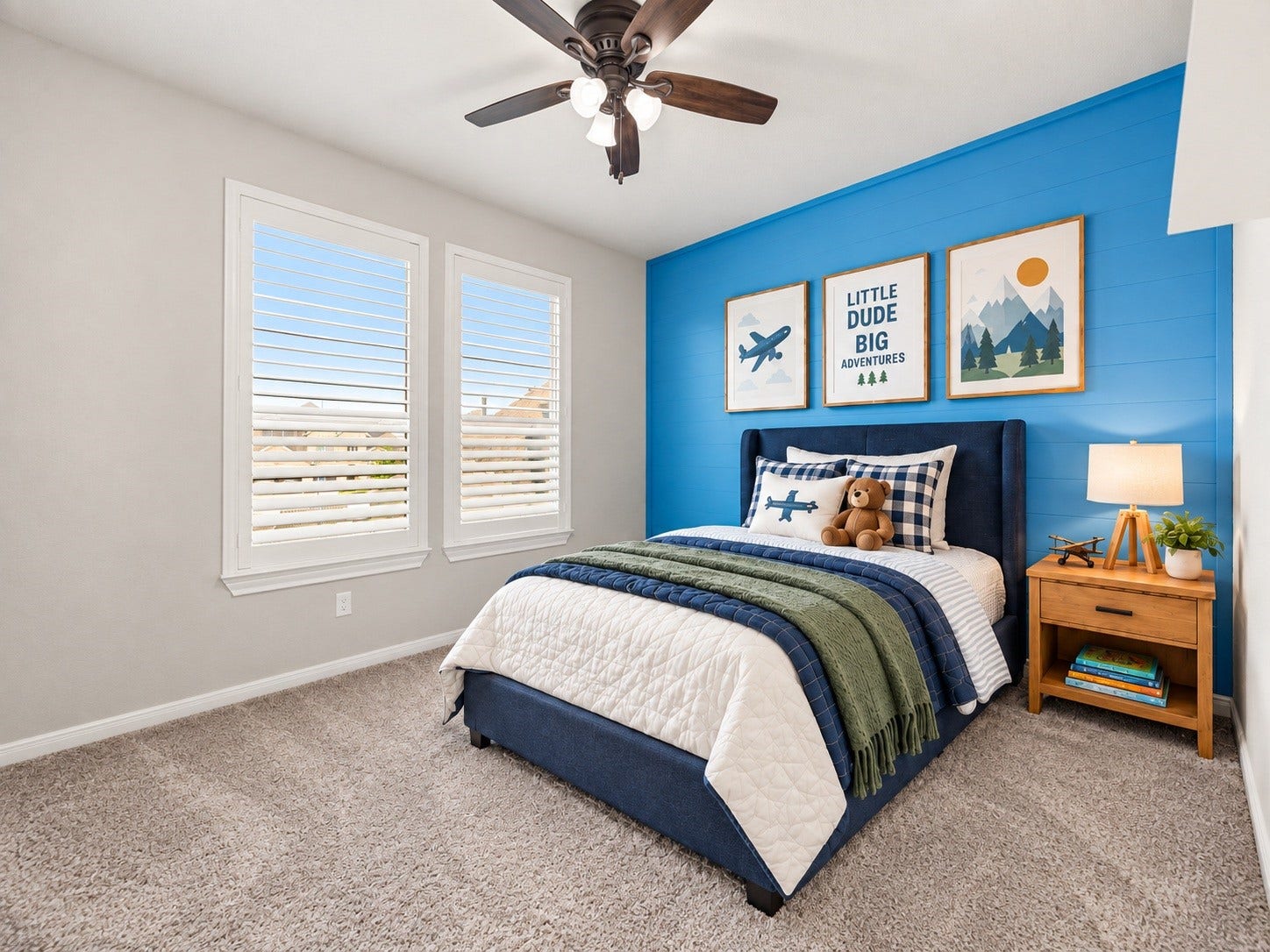 A secondary bedroom filled with natural light from two large windows, offering flexible space for a nursery, guest room, or home office. Virtually staged.