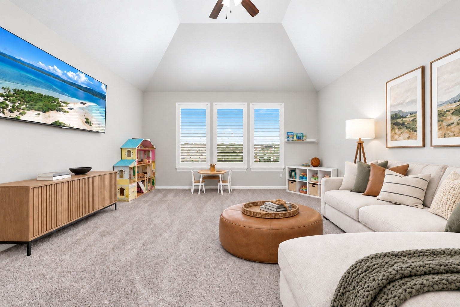 Upstairs opens into a large game room with a vaulted ceiling and plenty of space to make it your own. Virtually staged.