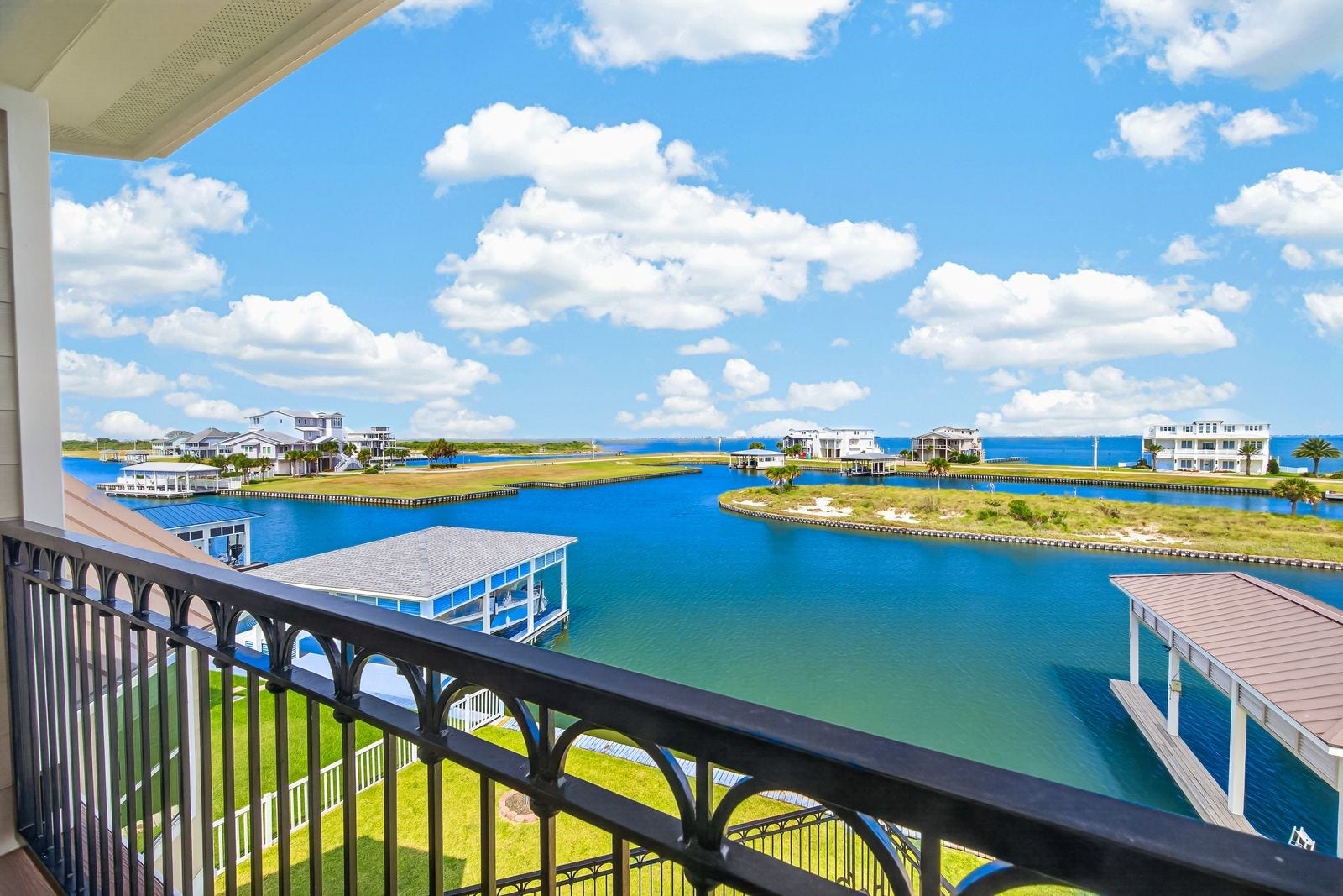 13 Sugarloaf, Hitchcock, TX 77563 Experience breathtaking West Bay views directly from your back patio, offering a serene and picturesque waterfront escape.