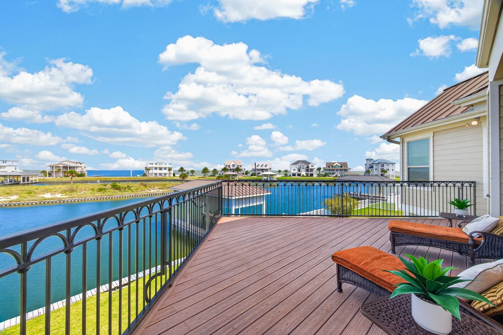 13 Sugarloaf, Hitchcock, TX 77563 Expansive waterfront deck with stunning views, perfect for relaxing and enjoying the serene surroundings.