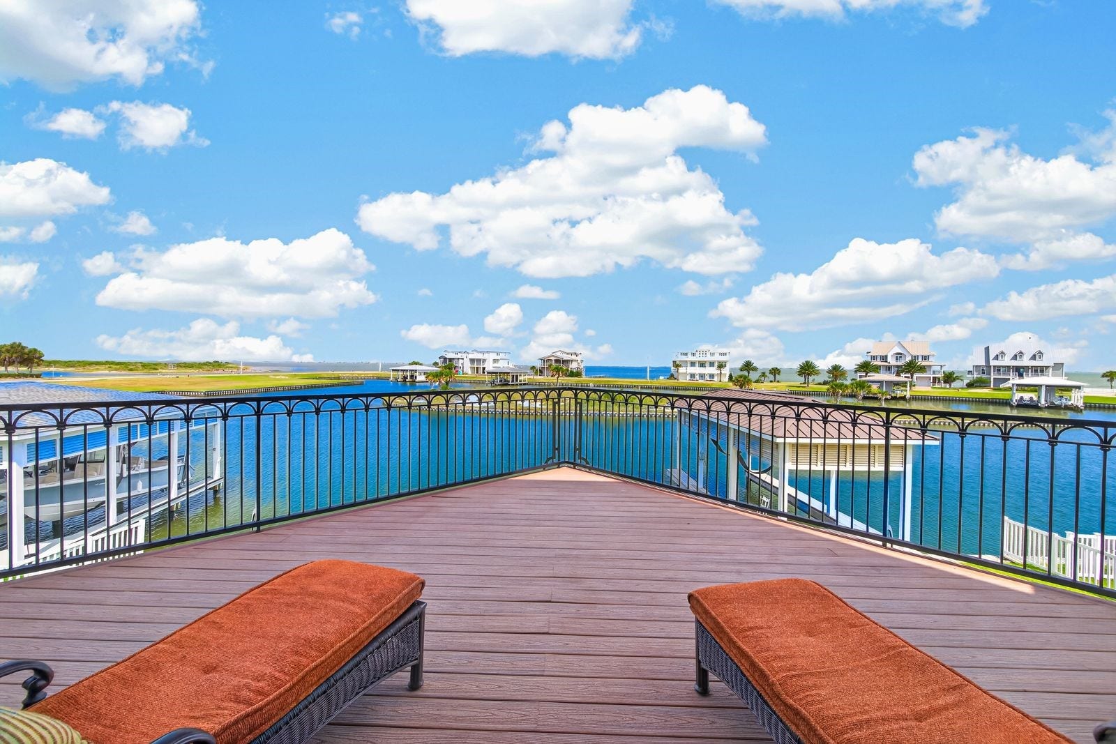 13 Sugarloaf, Hitchcock, TX 77563 Experience breathtaking island and lake views from one of two expansive balconies, perfect for relaxation and entertaining.