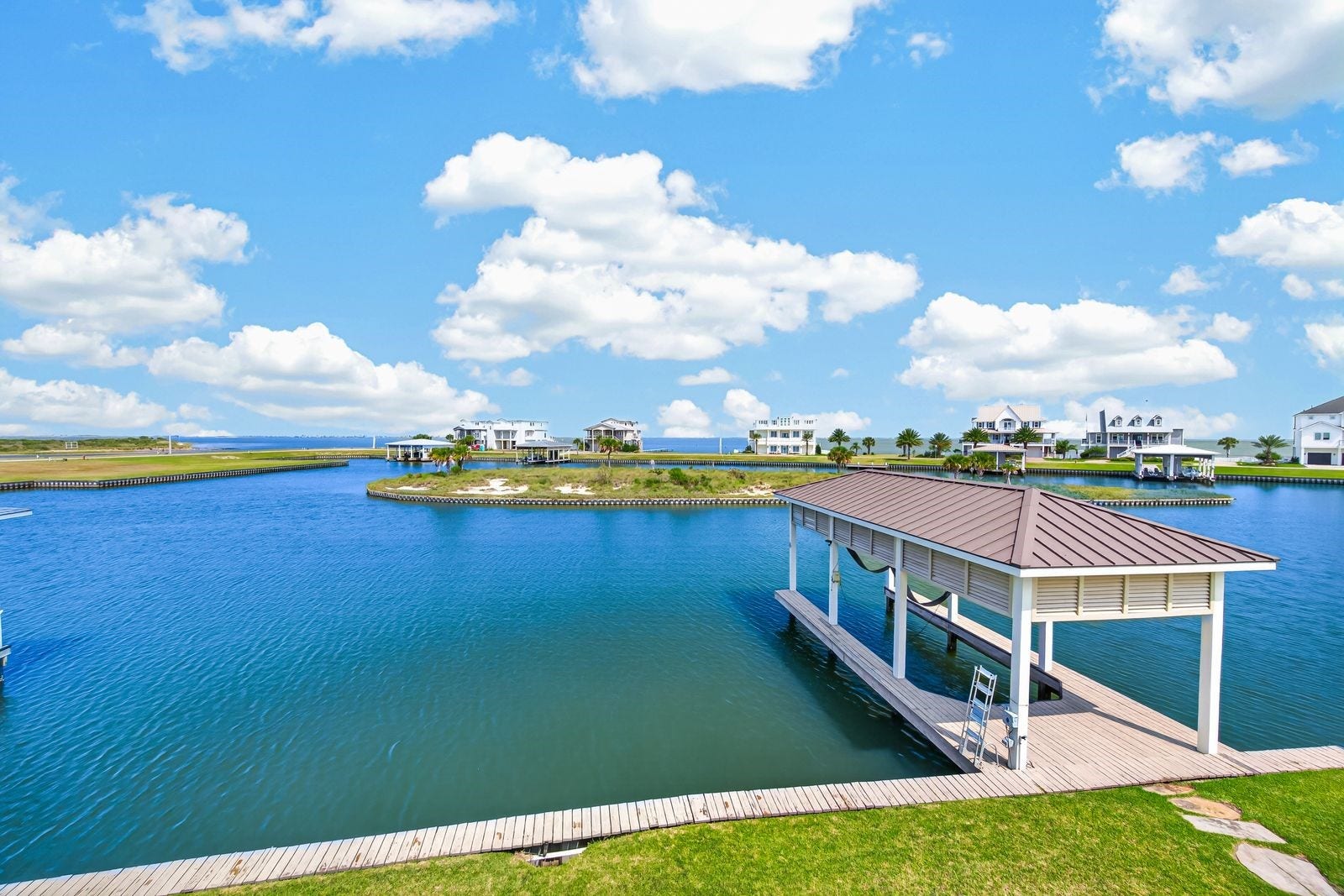 13 Sugarloaf, Hitchcock, TX 77563 Step out your door to a large boat dock, perfect for launching early morning fishing trips to West Bay.