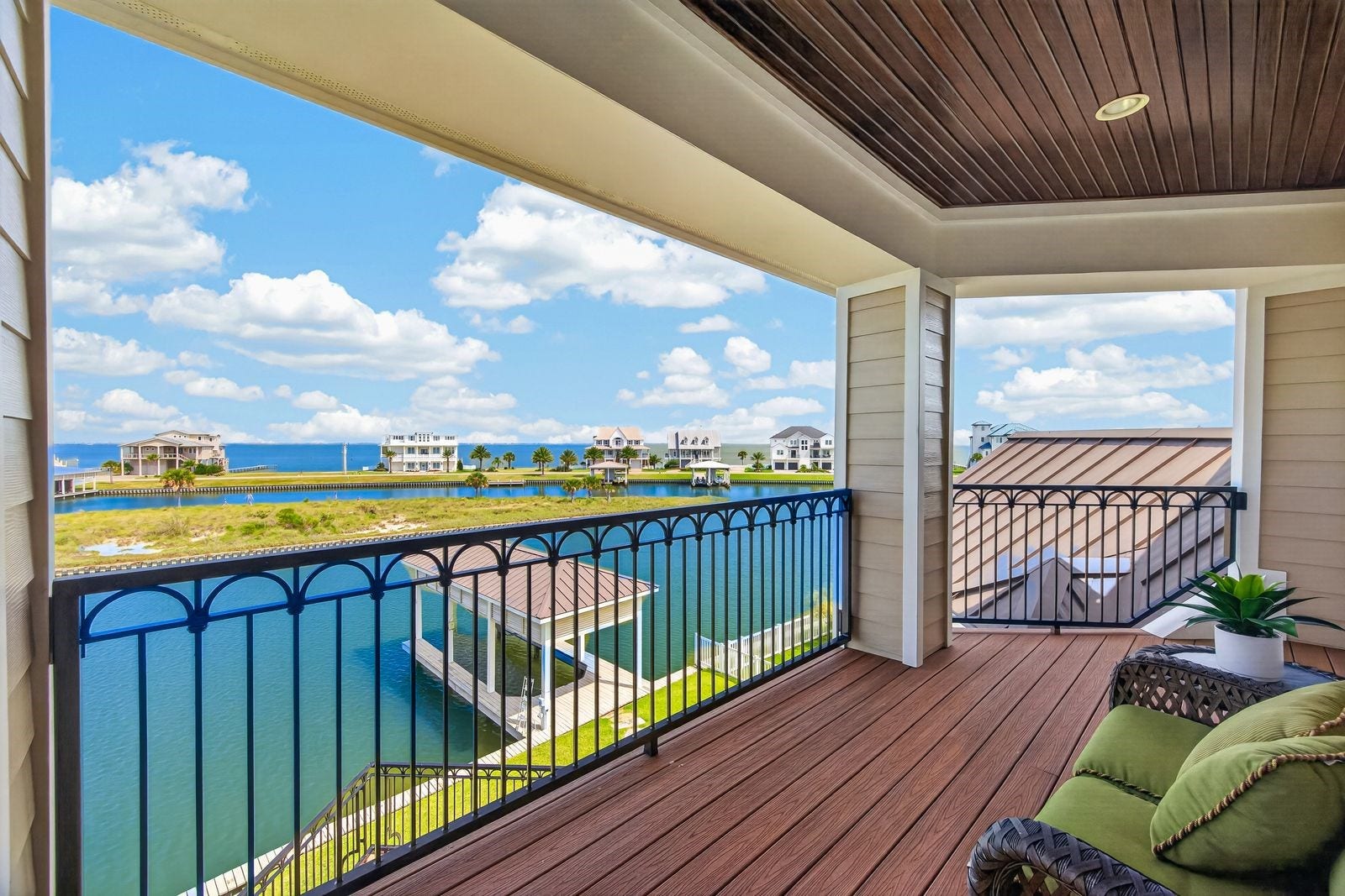 13 Sugarloaf, Hitchcock, TX 77563 Enjoy breathtaking water views from the second-floor balcony, perfect for soaking up the sun on a beautiful day.
