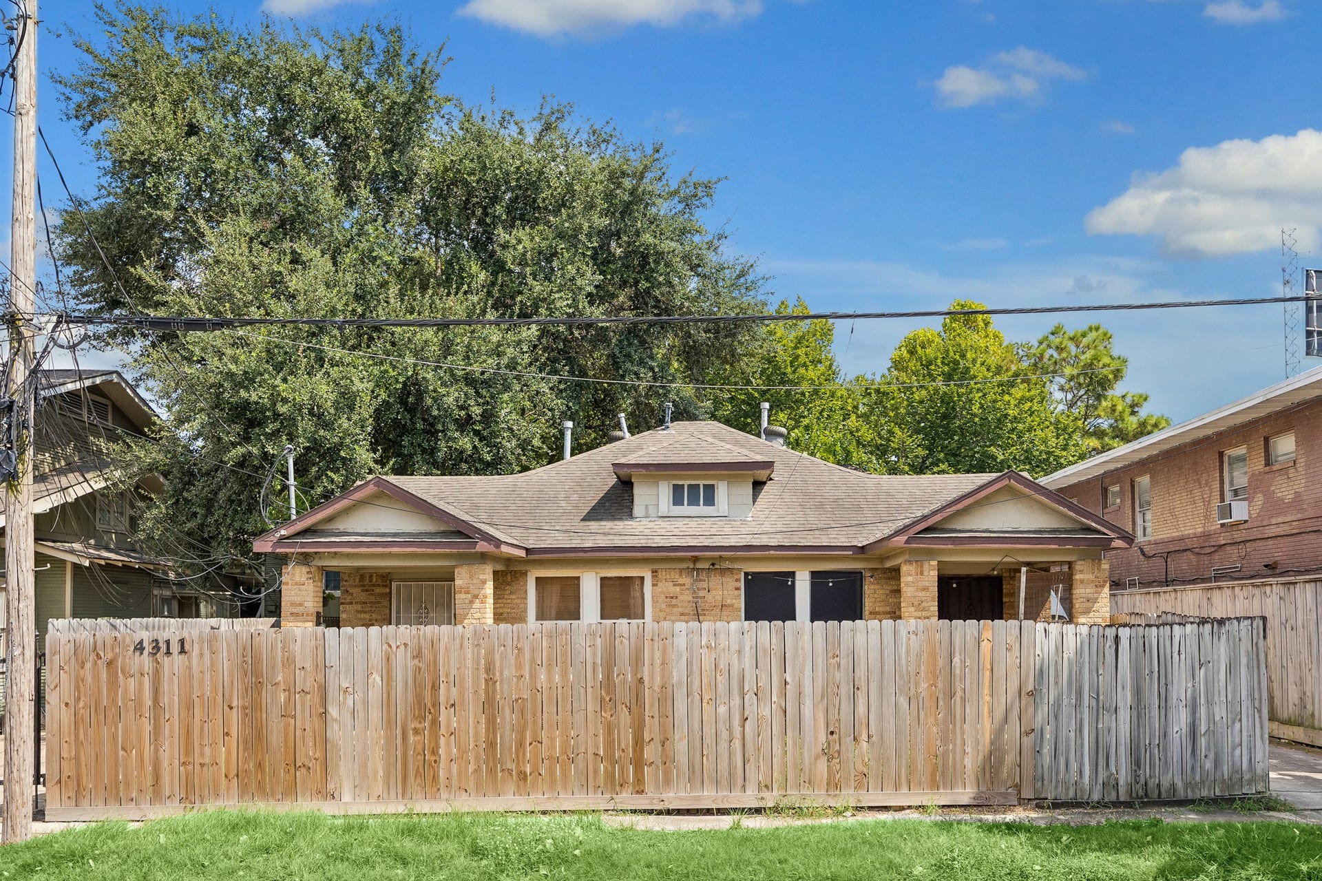 A view from the street showcases the privacy fence.