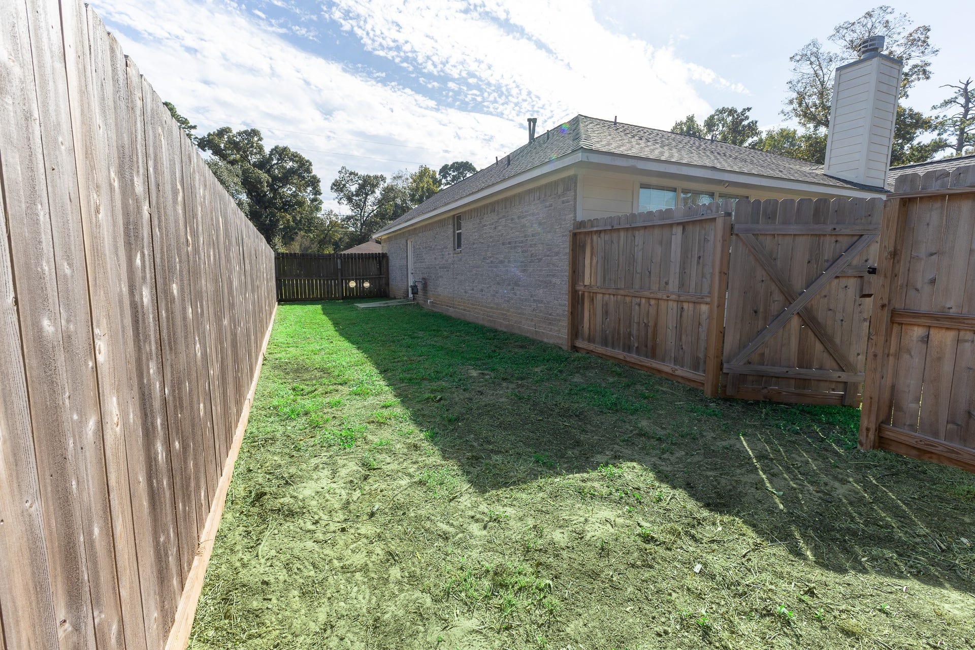 3302 Royal Oaks Drive, Spring, TX 77380 Spacious, fully fenced side yard with convenient gated access offers extra privacy and plenty of room for pets to roam and play! A wonderful bonus outdoor space with added flexibility and functionality.