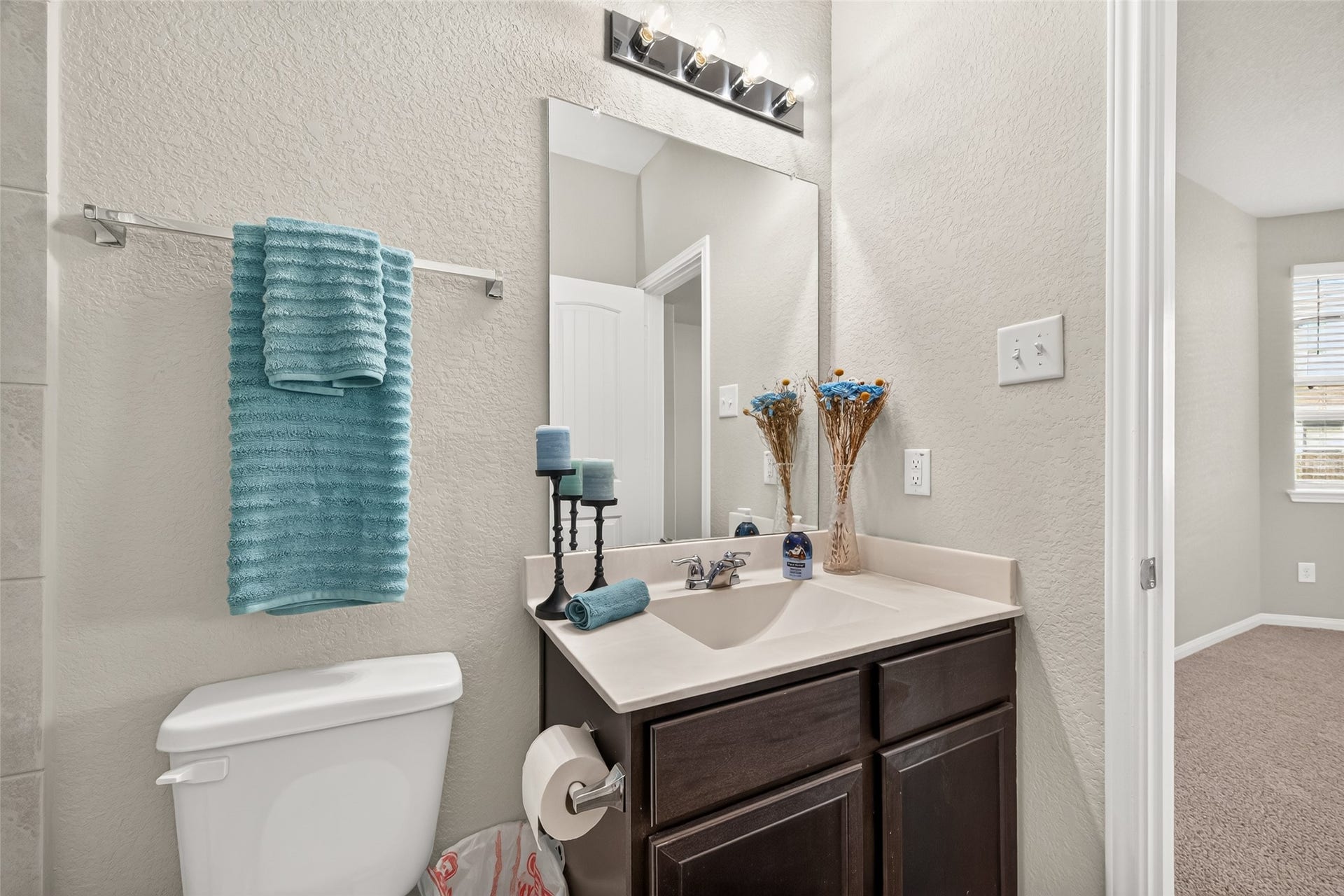 13405 Cannon Creek Court, Willis, TX 77378 Charming bathroom with a sleek vanity and modern fixtures.