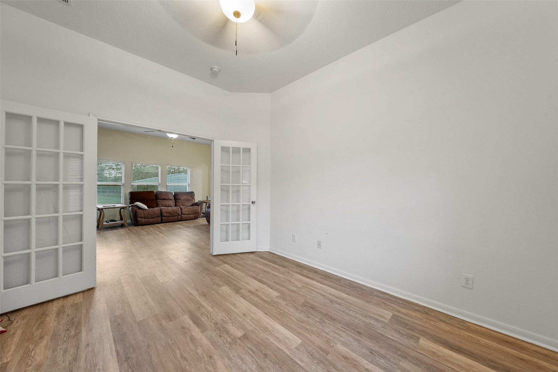 Versatile flex room with French doorsideal for a home office, study, or additional living space.
