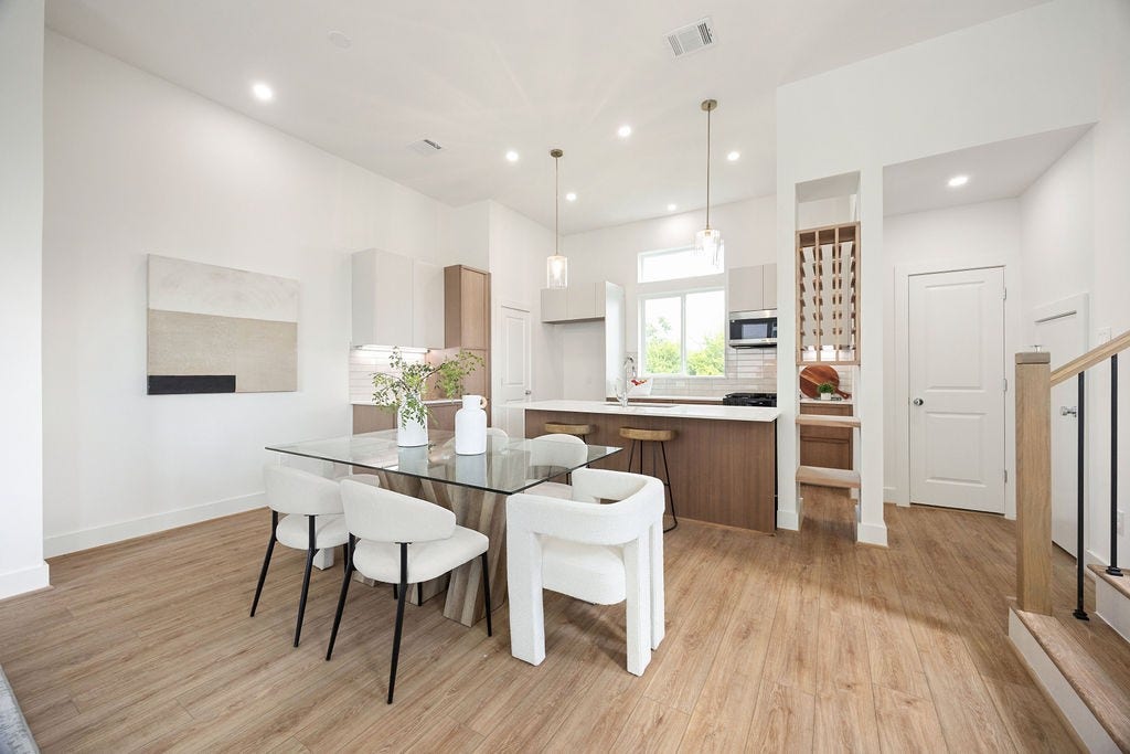 Dining area that flows seamlessly into the kitchen, perfect for gatherings.