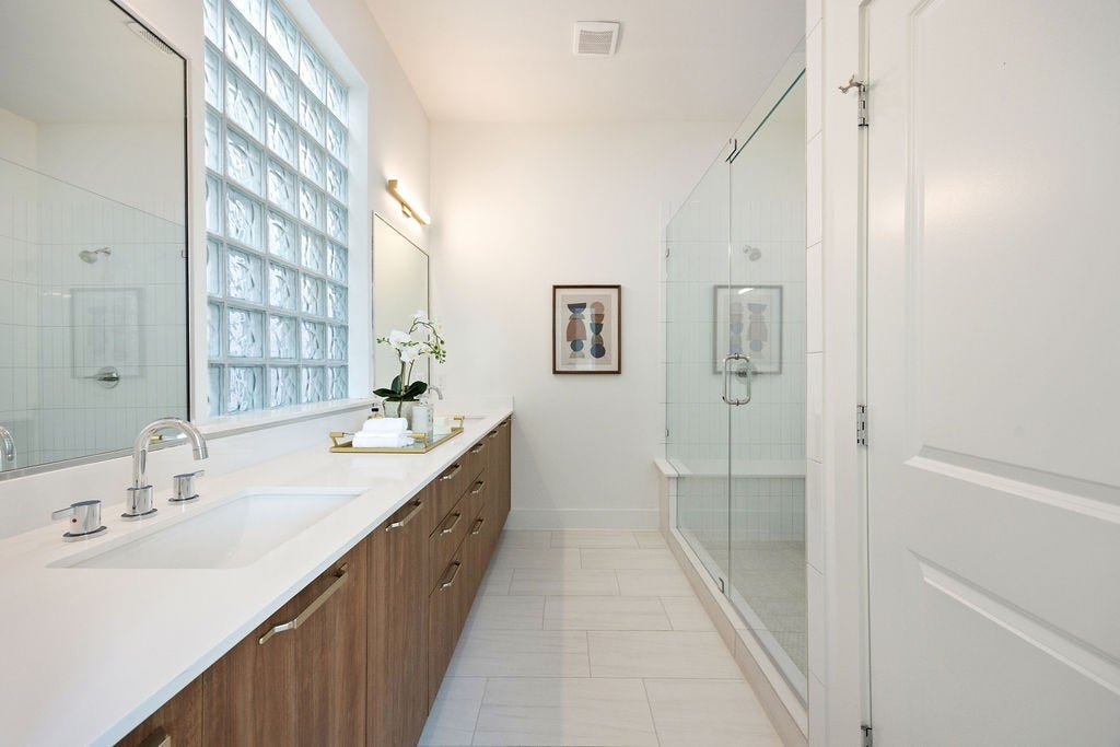 Spa inspired primary bathroom with an oversized walk in shower.