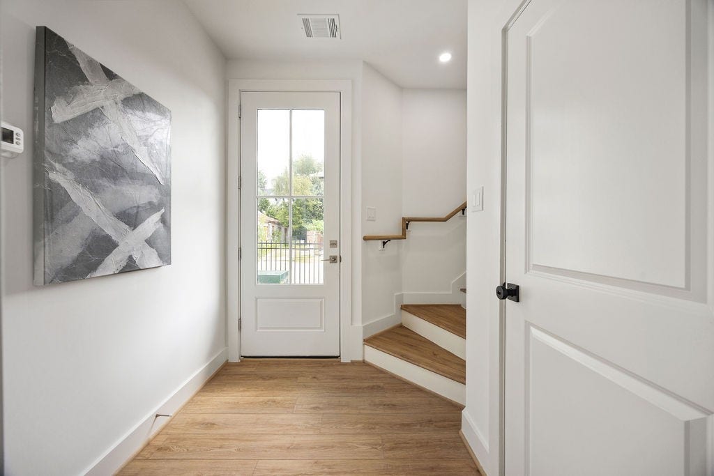 Welcoming entryway with direct access to the attached two car garage, complete with a garage door opener.