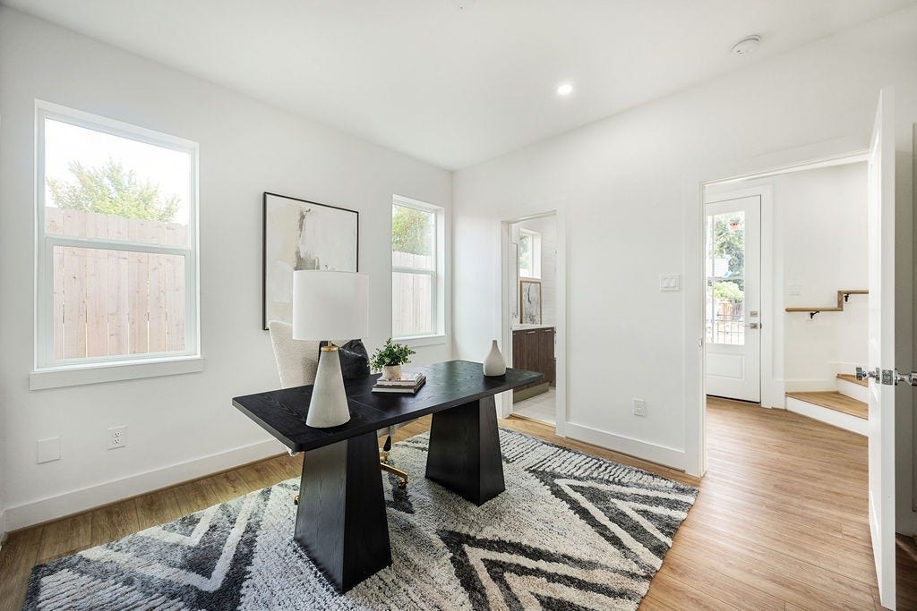 Versatile first floor bedroom with a full bath, perfect for guests or a home office.