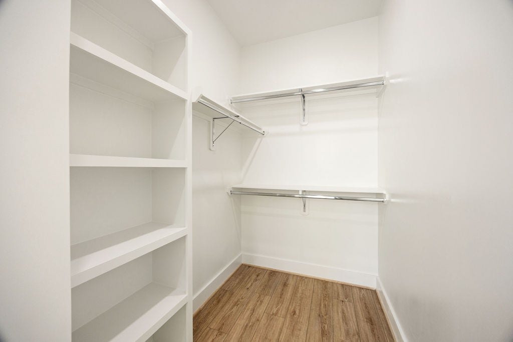 Dual walk in closets in the primary suite provide exceptional storage and organization.