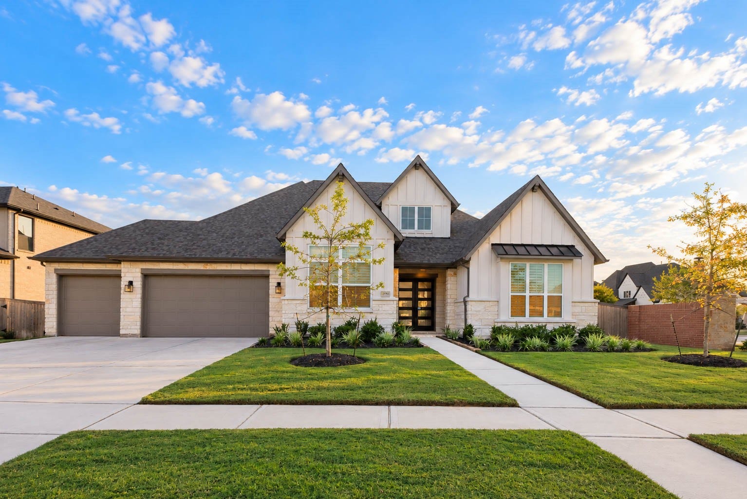 4839 Summer Place Court, Fulshear, TX 77441 Stunning modern farmhouse with a charming gabled roof, spacious three-car garage, and beautifully manicured landscaping.