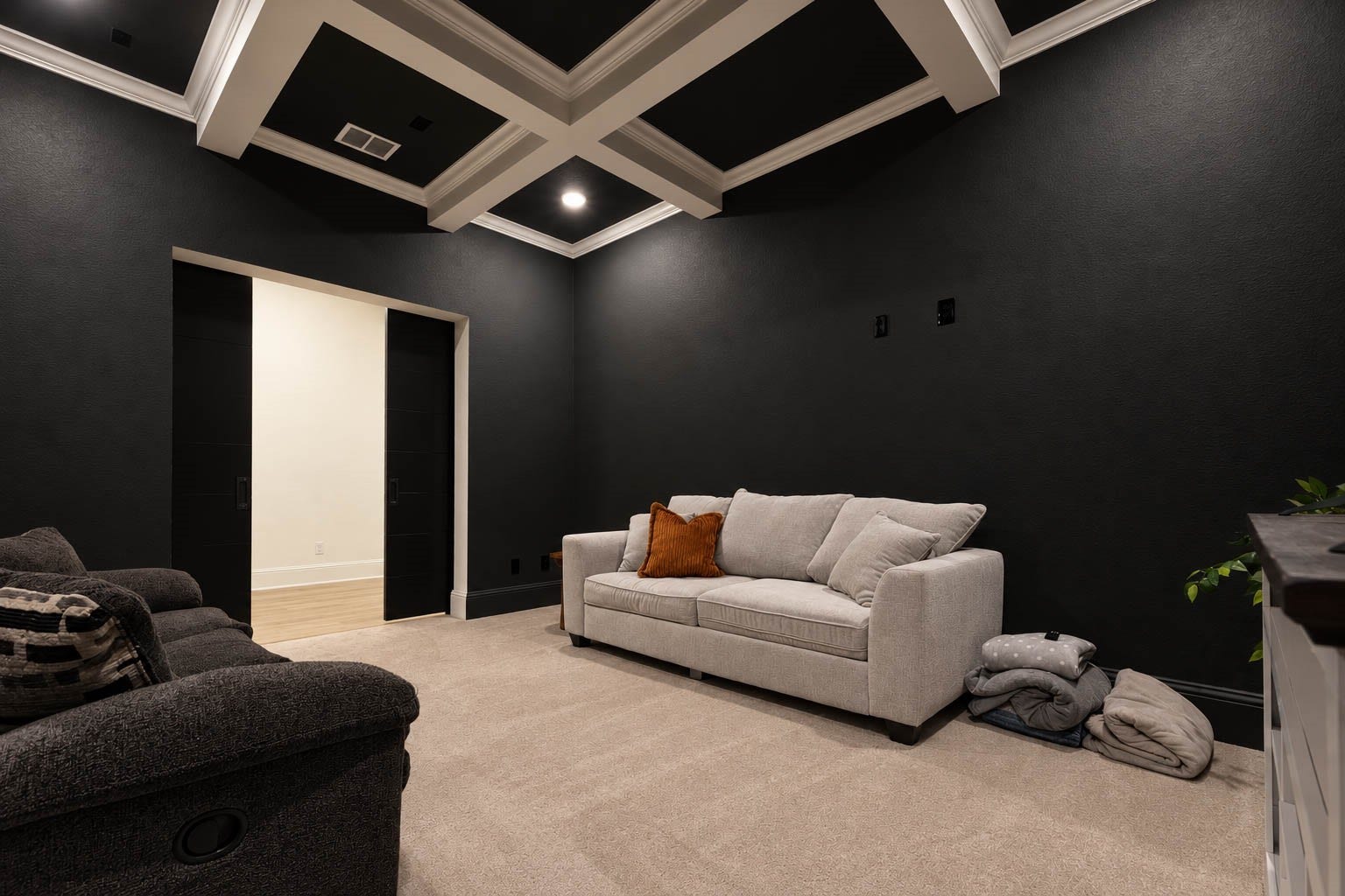 4839 Summer Place Court, Fulshear, TX 77441 Elegant media room with dark walls and coffered ceiling, featuring dark colors painting. On the first floor. See yourself with family and friends watching a great movie or football game.