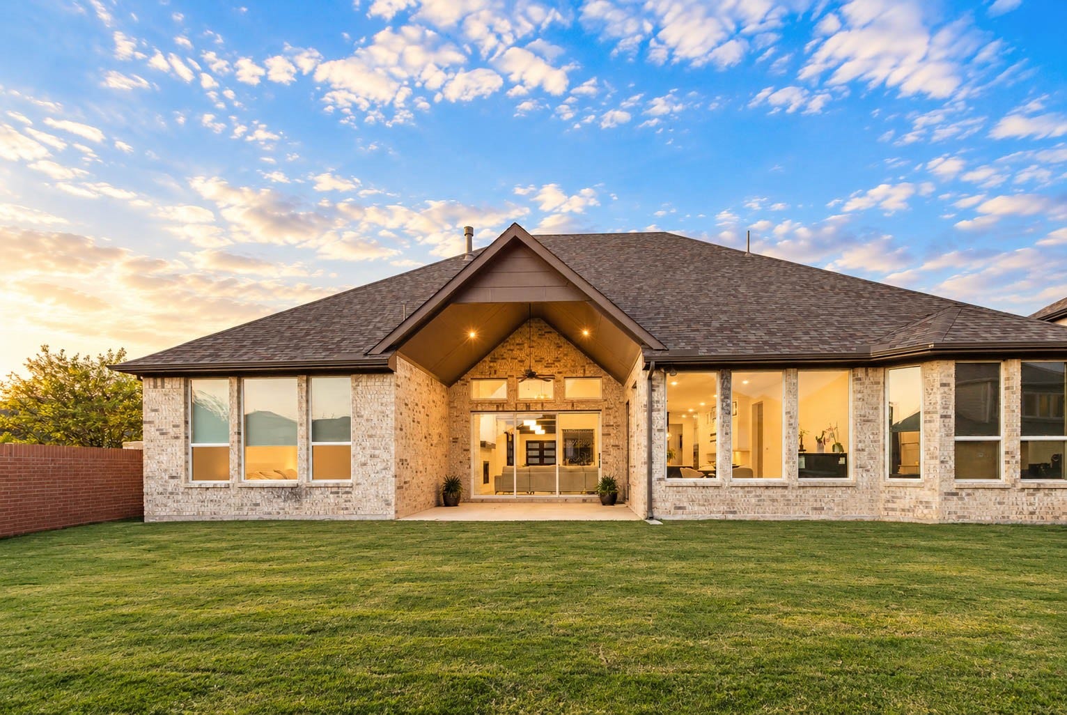4839 Summer Place Court, Fulshear, TX 77441 Stunning modern home with expansive windows, beautiful brick exterior, and a spacious backyard, perfect for enjoying serene sunsets. Don't overlook the sliding doors that will unite the 2 atmosphere seamlessly