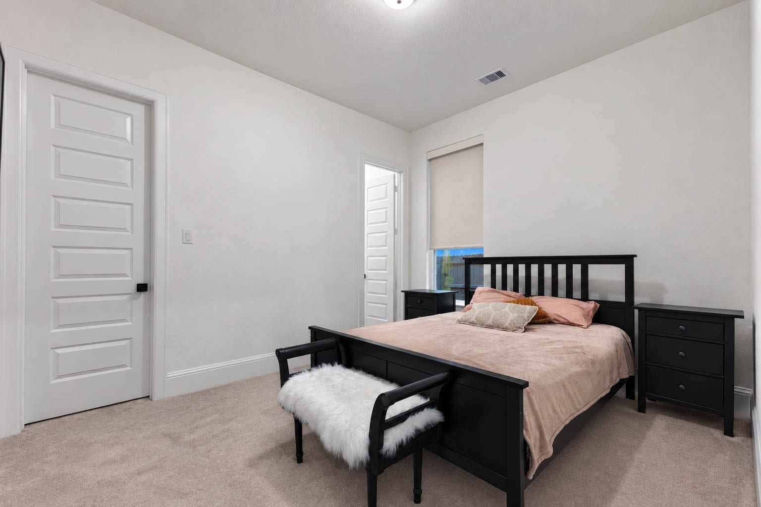 4839 Summer Place Court, Fulshear, TX 77441 Cozy bedroom with neutral tones with soft carpeting for a welcoming atmosphere.
