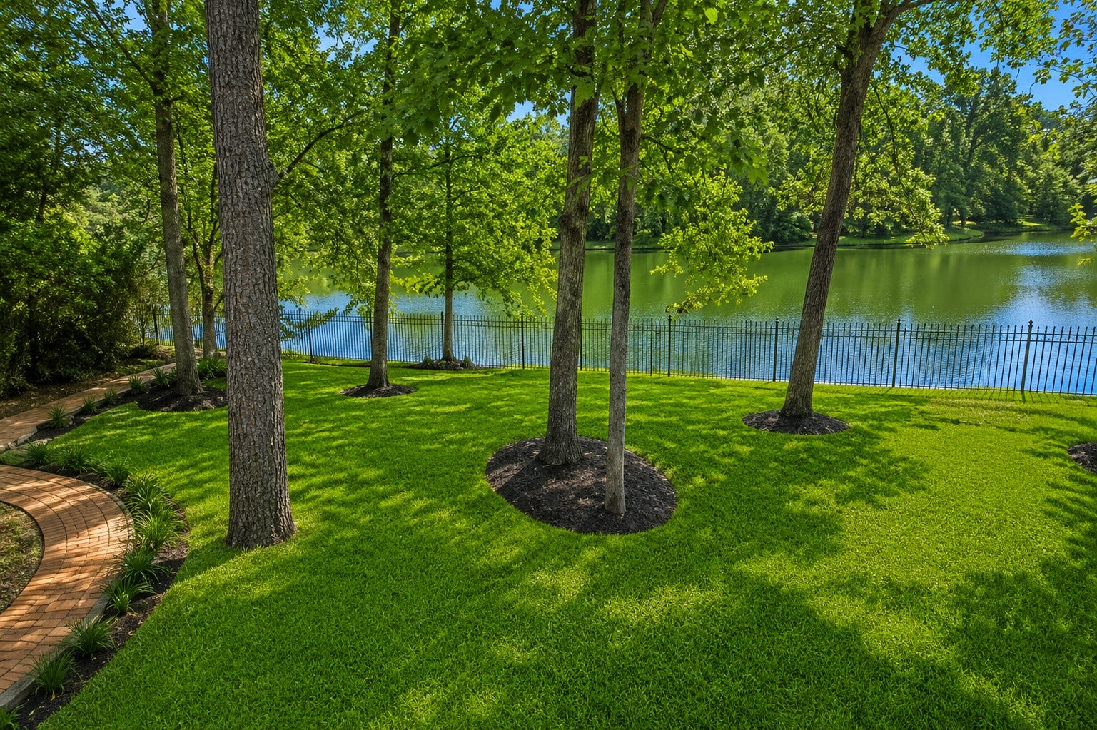 7 Pastoral Pond Circle, The Woodlands, TX 77380 The views from this property are truly stunning. This particular shot is taken from the spacious upper balcony, which is accessible from both the game room and a secondary bedroom
