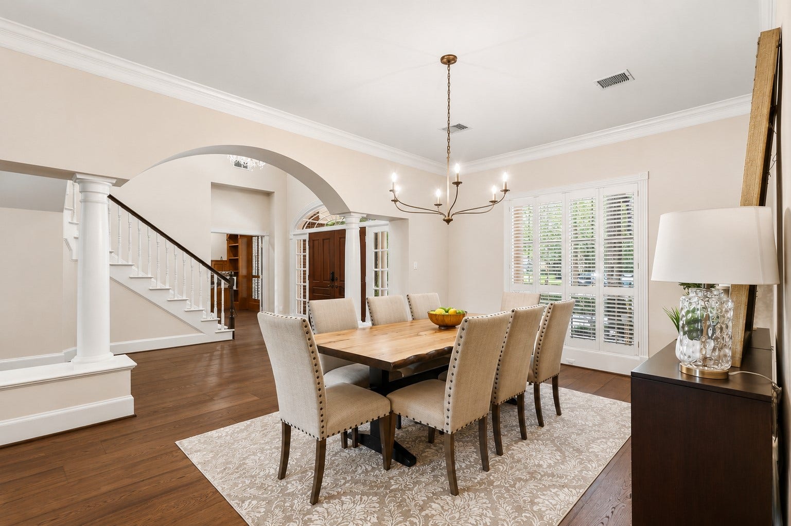7 Pastoral Pond Circle, The Woodlands, TX 77380 Dining room featuring plantation shutters and an updated chandelier