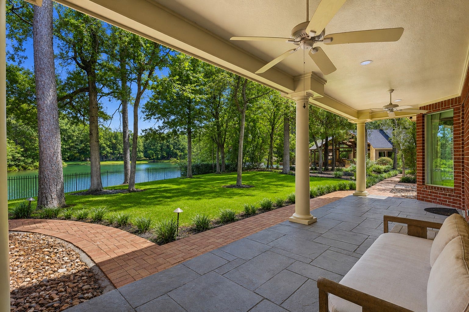 7 Pastoral Pond Circle, The Woodlands, TX 77380 This one-of-a-kind, park-like property features a main home and a guest house situated on a double waterfront lot
