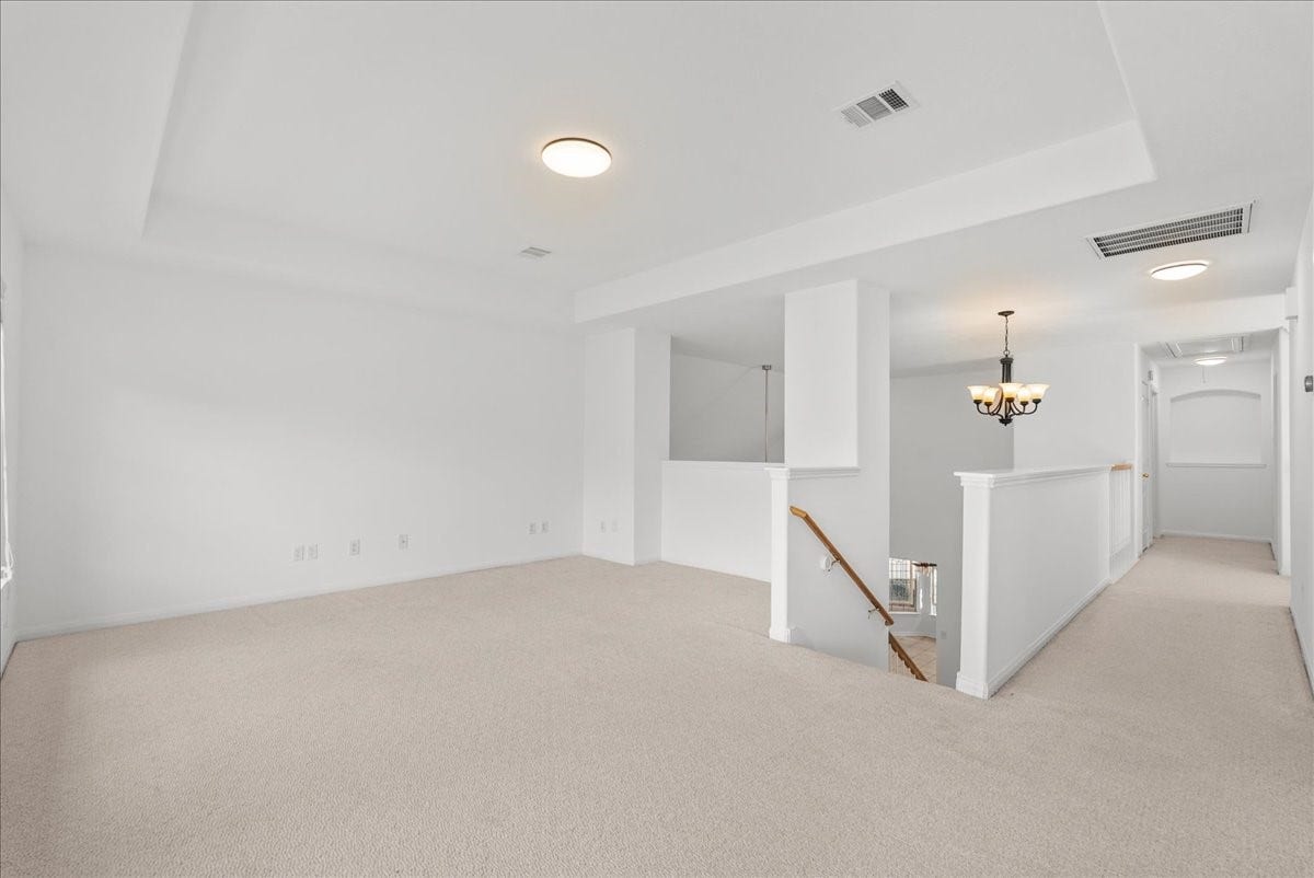 311 Lake Front Drive, League City, TX 77573 The upstairs game room is accented with a tray ceiling and plenty of room for your imagination to run wild with what to do with this space!