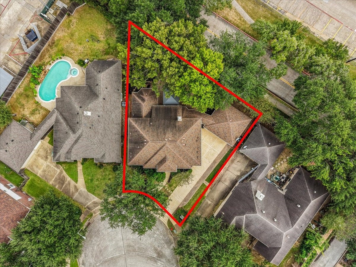 311 Lake Front Drive, League City, TX 77573 Aerial view outlining the lot, surrounded by mature trees.