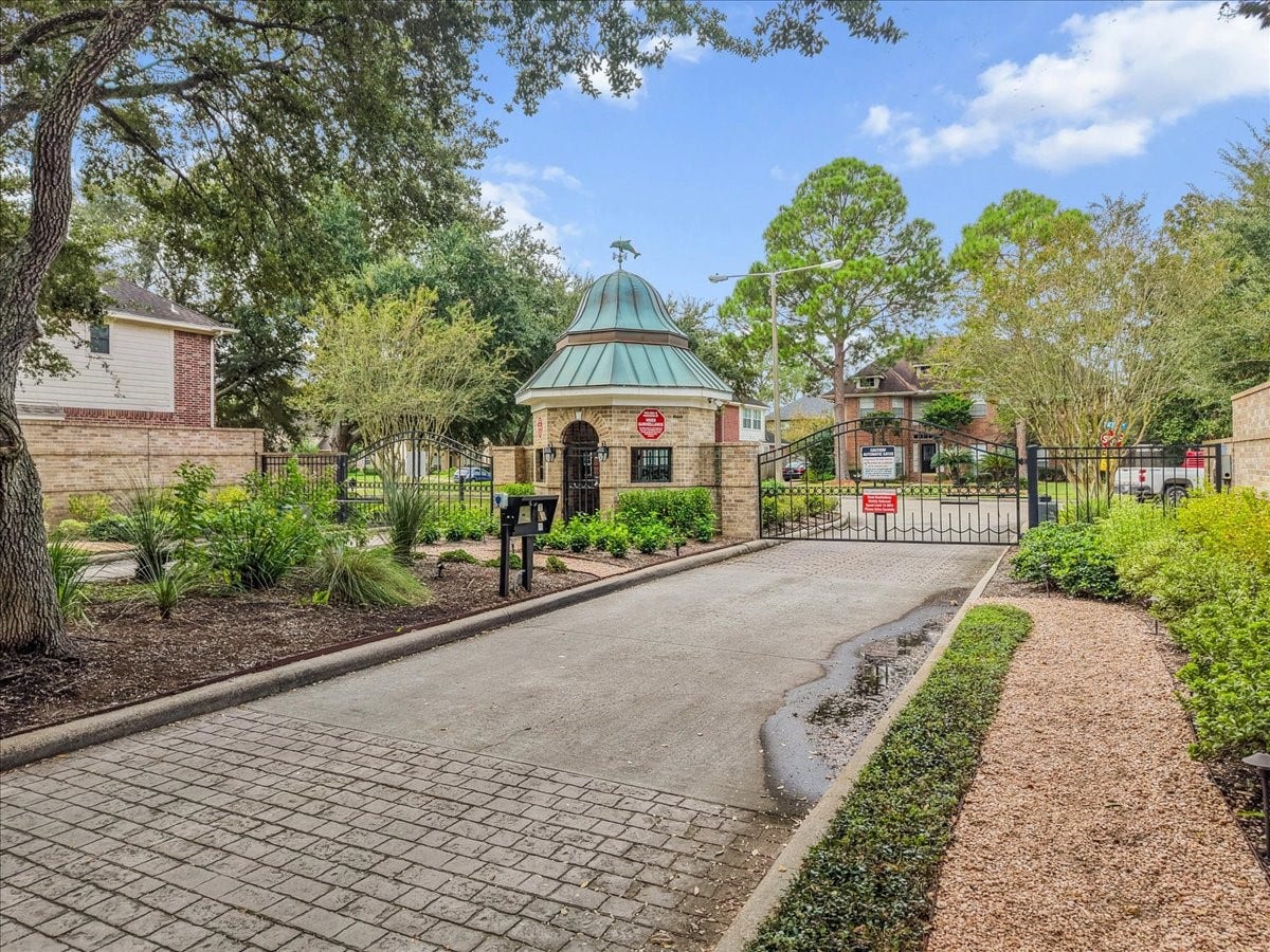311 Lake Front Drive, League City, TX 77573 The Lakefront Preserve is a gated community with controlled access and a lovely tree-lined entrance.