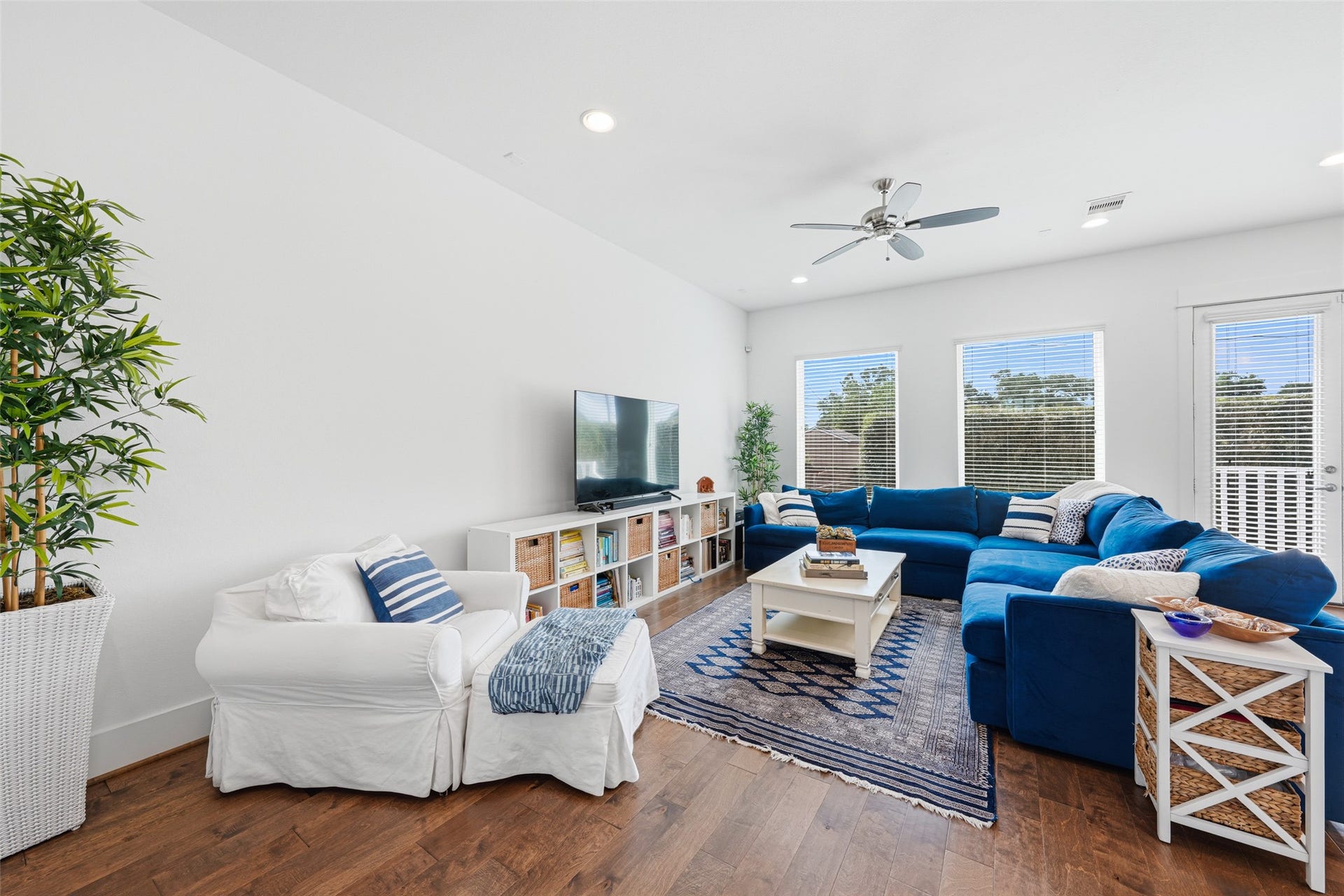 Open living area with views to the pool and backyard.