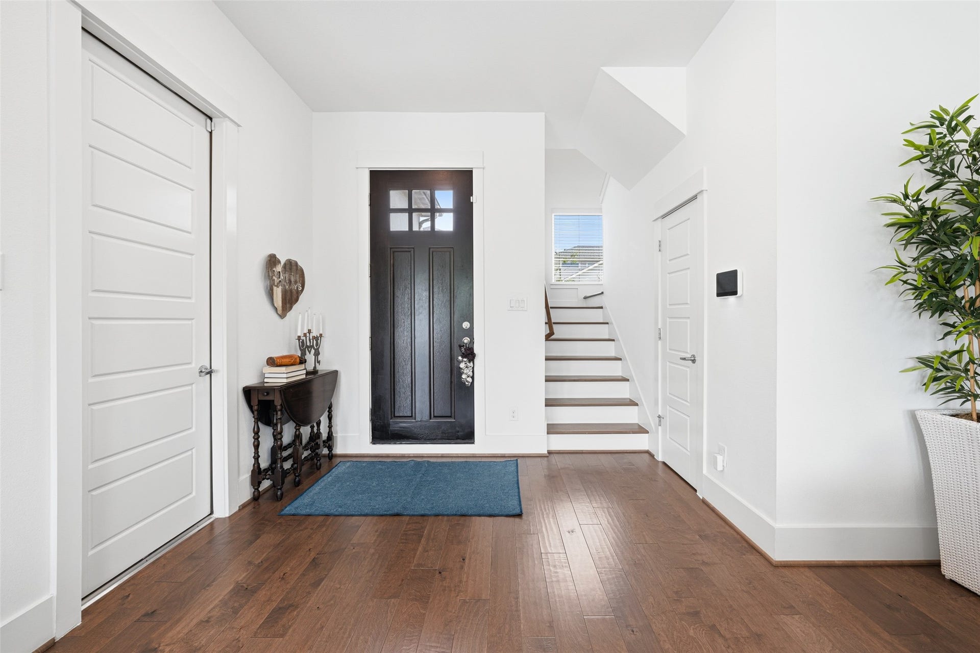 Light and bright entryway with neutral tones throughout.